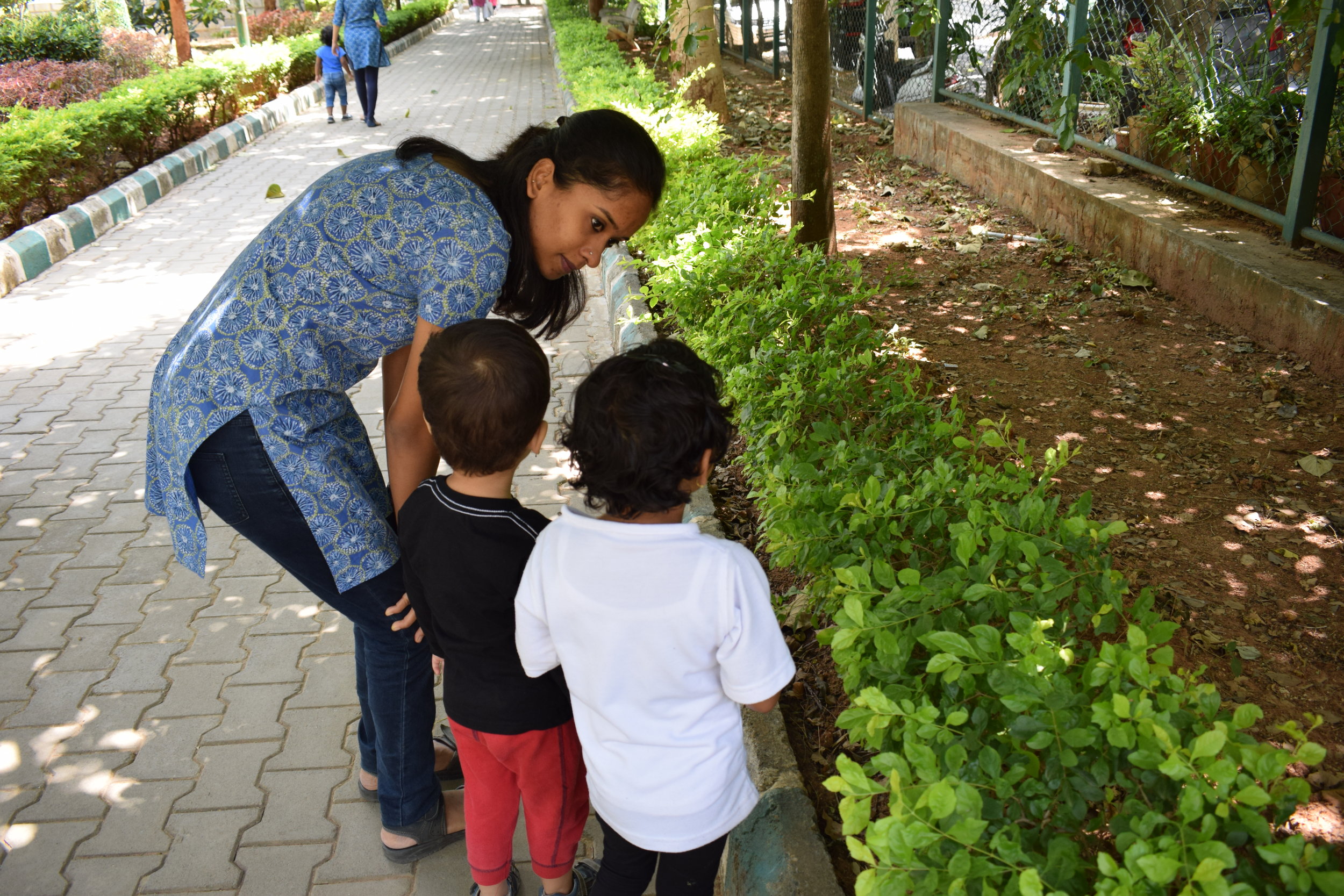 Educator guiding children on a field trip