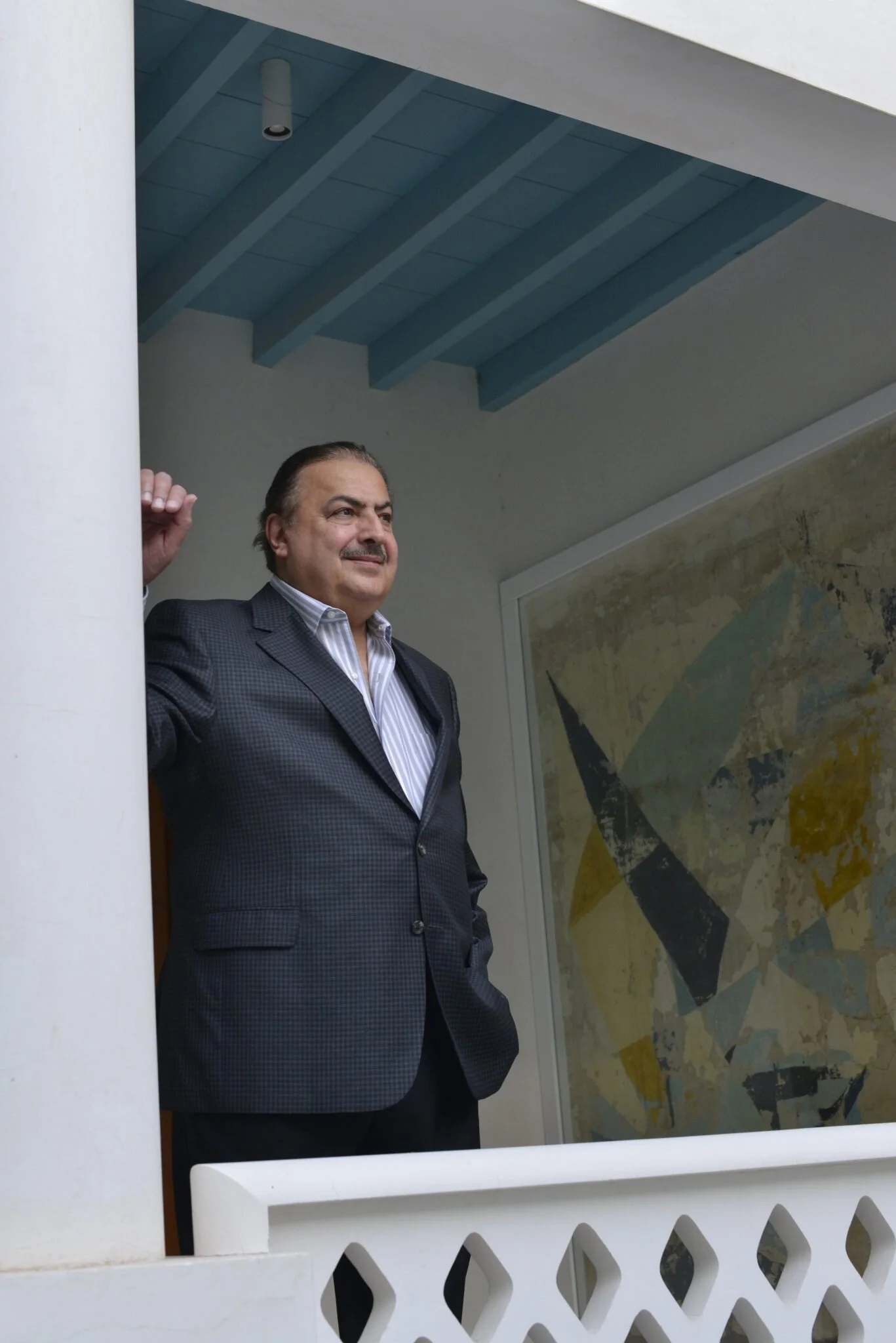 Rashid Al Khalifa standing aside his mural painting at Riffa Majlis, Riffa, Kingdom of Bahrain, 2016. Photo: Manfred Erber
