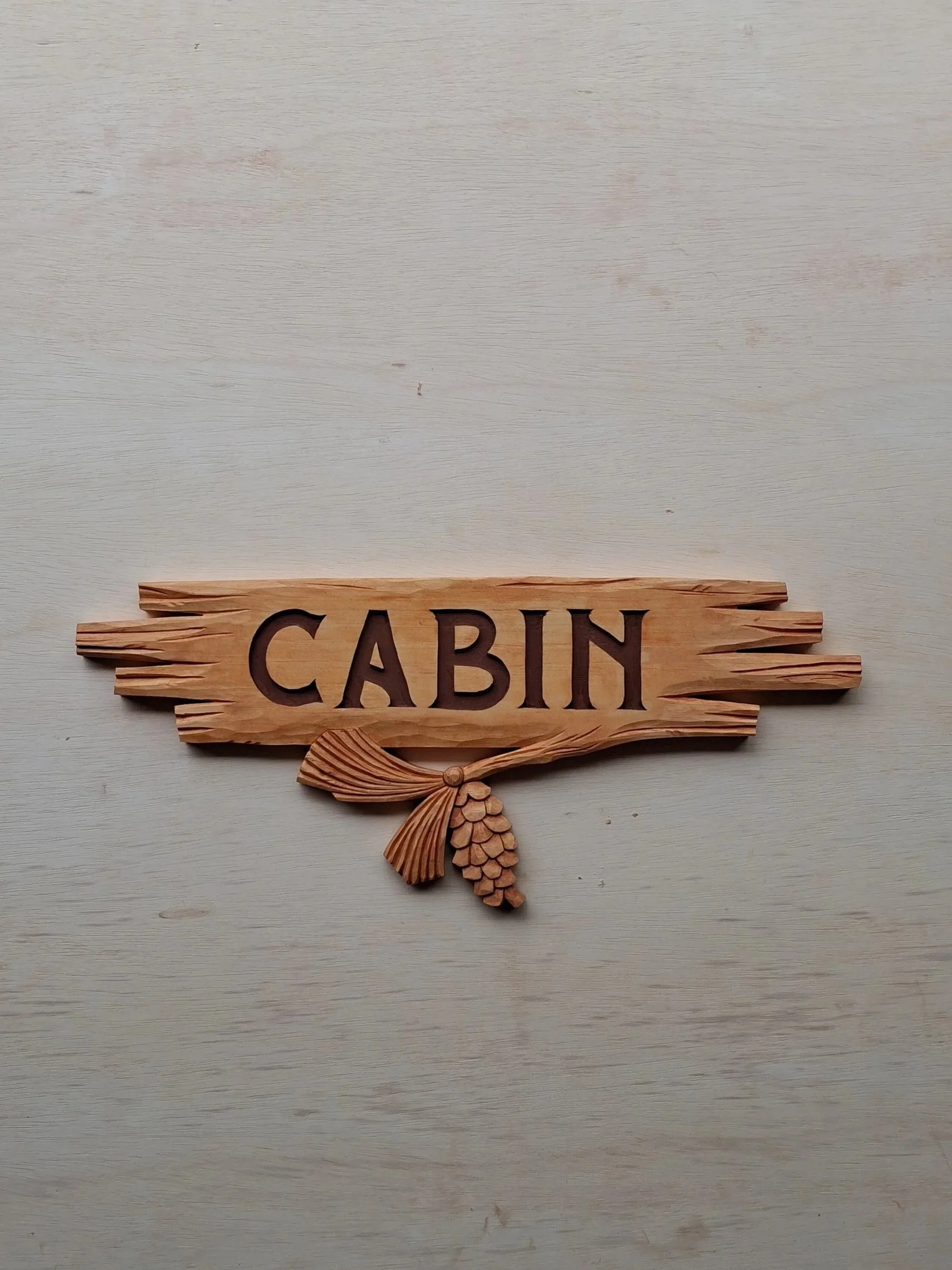 A unique hand carved cabin sign.