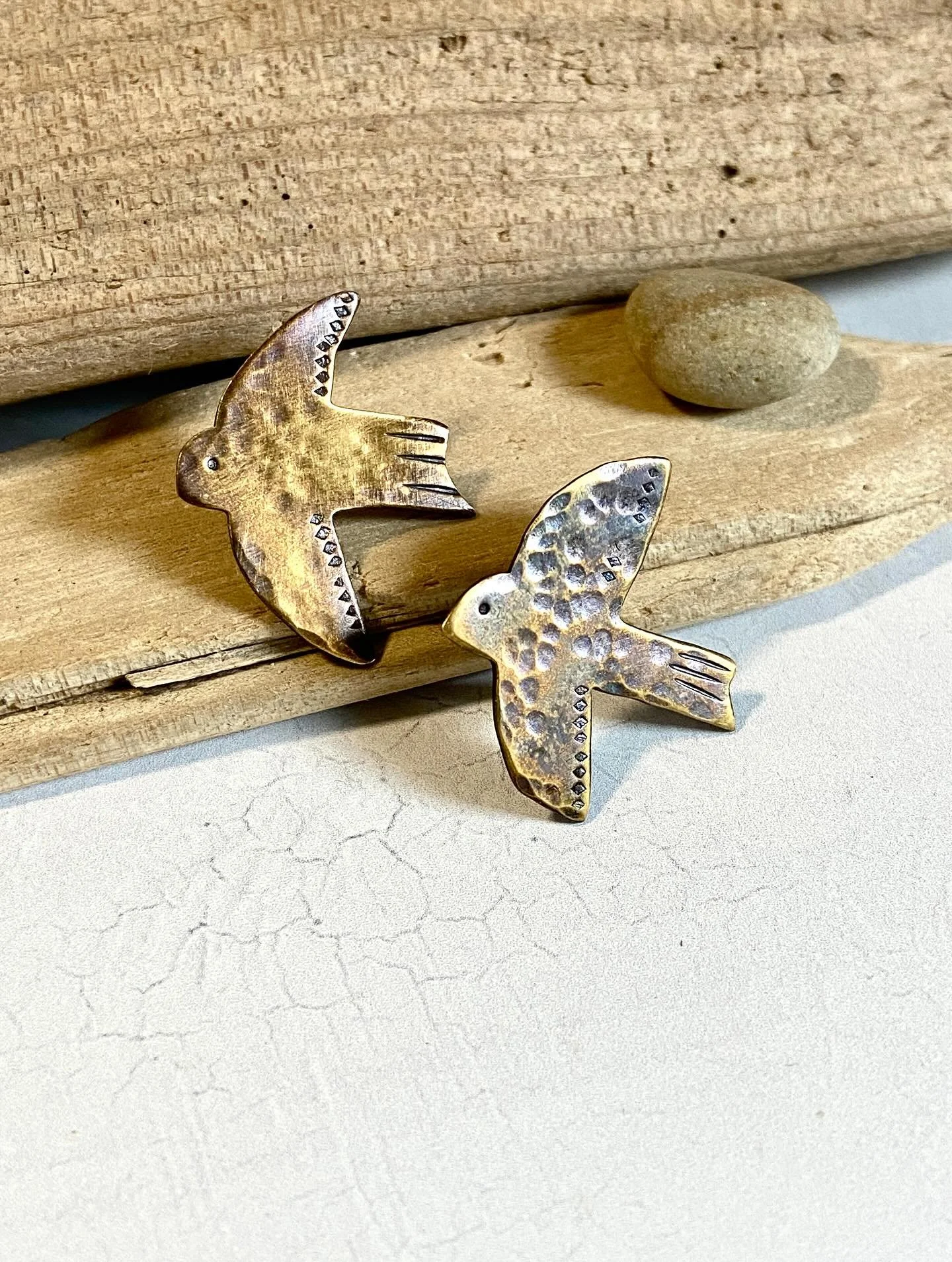 Bird pins, bird earrings and bird necklaces in brass ~ some with touches of gold. Birds are often symbols of peace, which is something the world needs now. Check them out on my website in the charms and pins section, as well as the silver and stone s