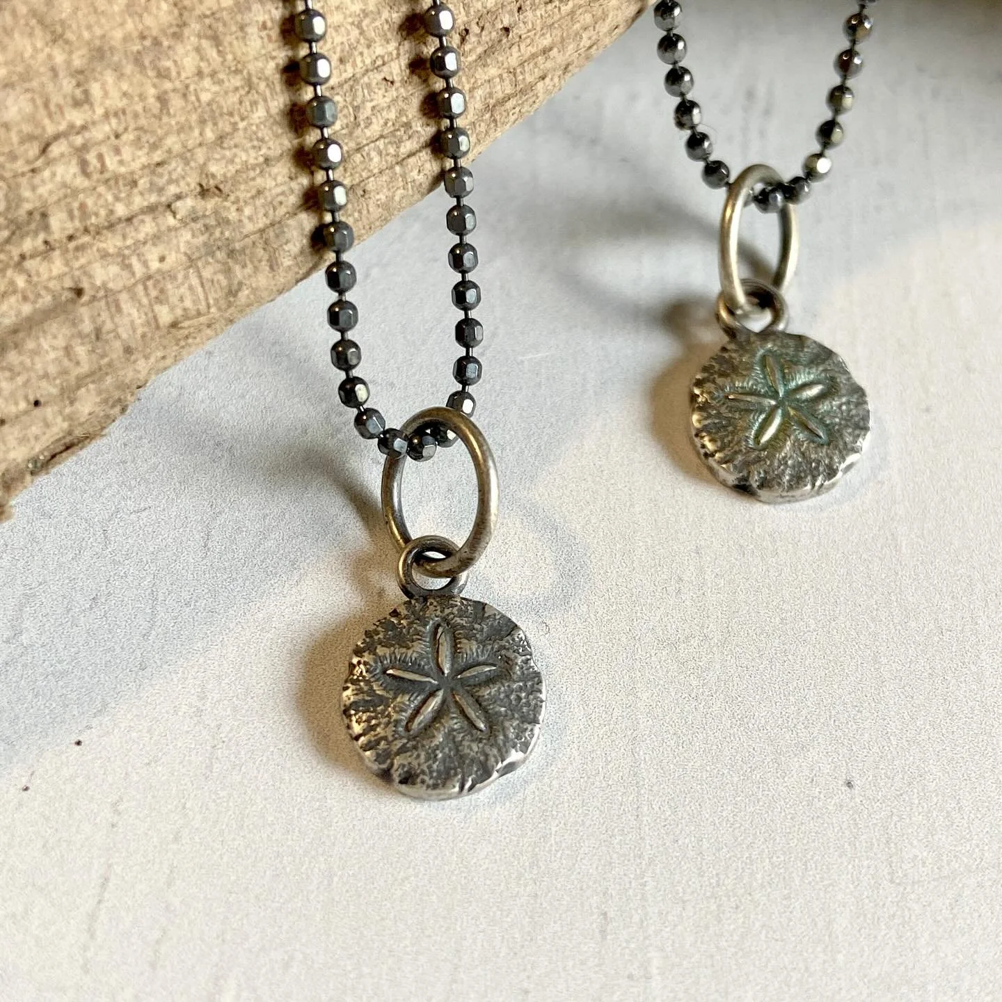 In the eel grass on our community beach here are thousands of little sand dollars.  I was so excited the first time we came across them. 

When I was young, the beaches in New Hampshire were bereft of the amazing little creatures. Whenever we would g