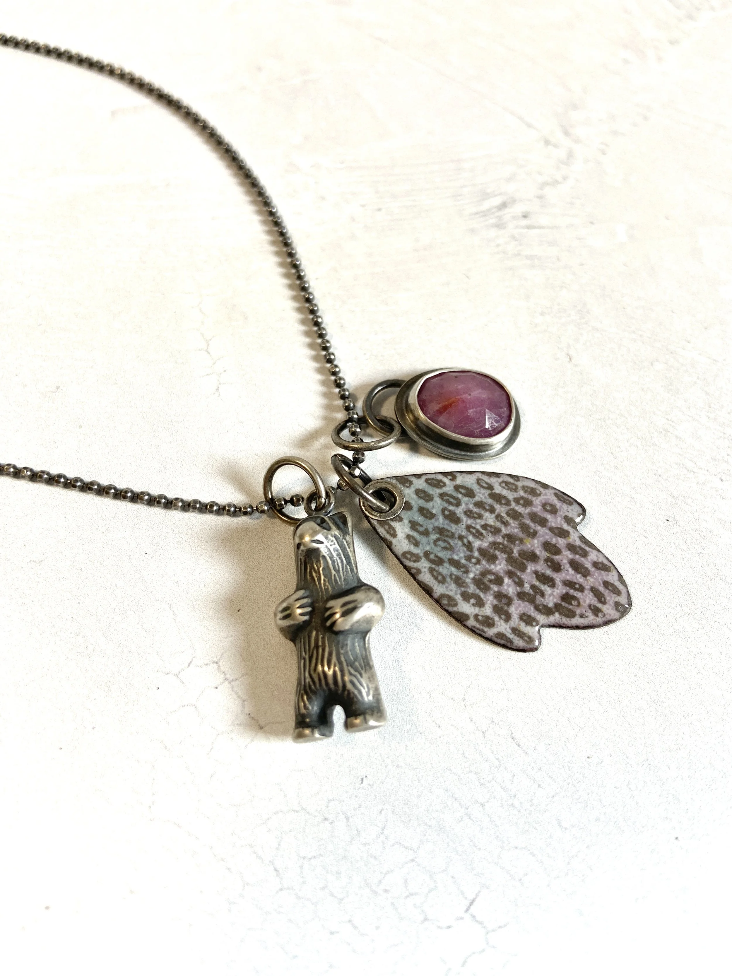 Adorable 3D sterling silver bear charm necklace with enamel petal charm and bezel set pink sapphire