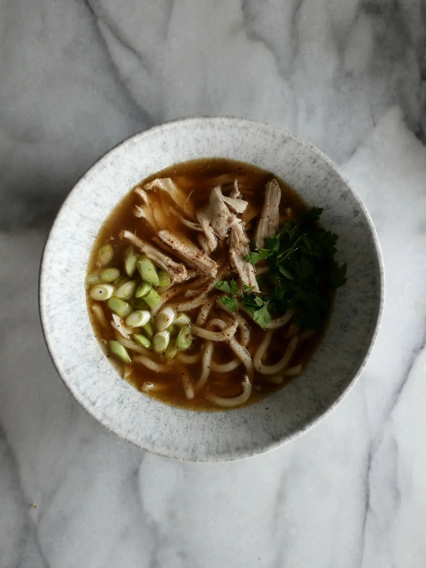 Leftover roast chicken turned into broth, udons and topped with spring onion, coriander, and our very best Kampot Red Pepper, grown on our family run farm in Cambodia!

'These are delicious and that heat is fruity, pungent, fragrant and very deliciou
