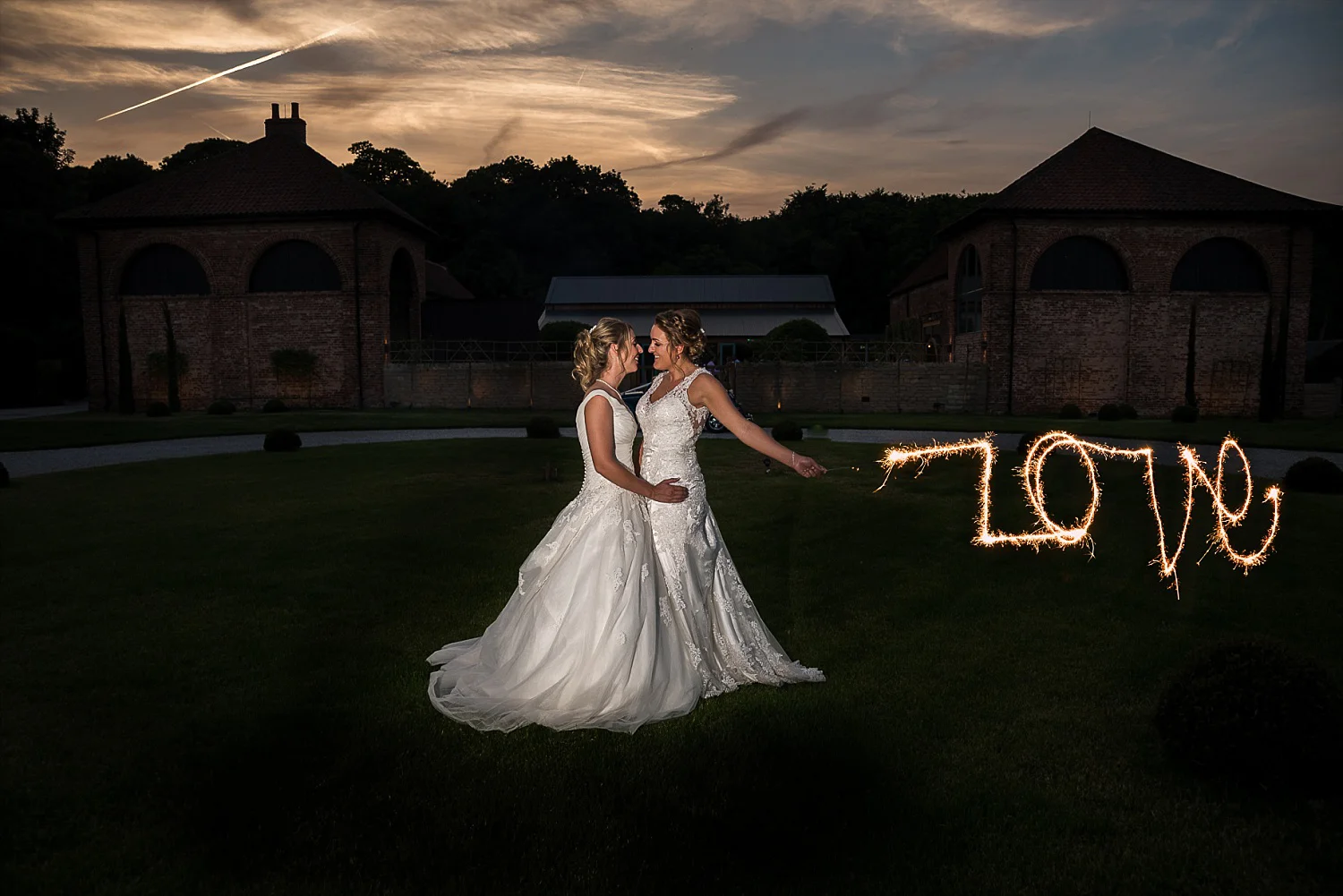 Dramatic sunset photo LGBT wedding