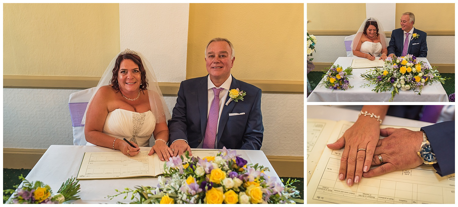 bride and grrom signing the register