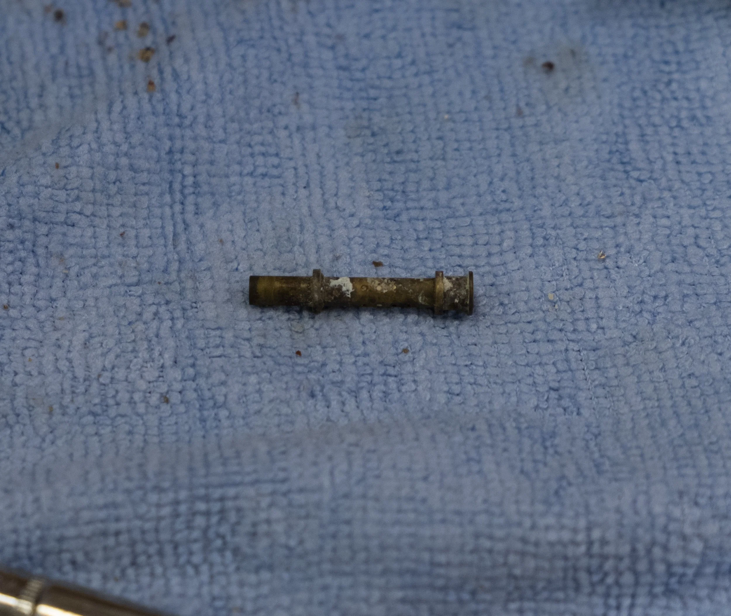 The fuel nozzle, with many tiny holes corroded over. No wonder the engine did not run.