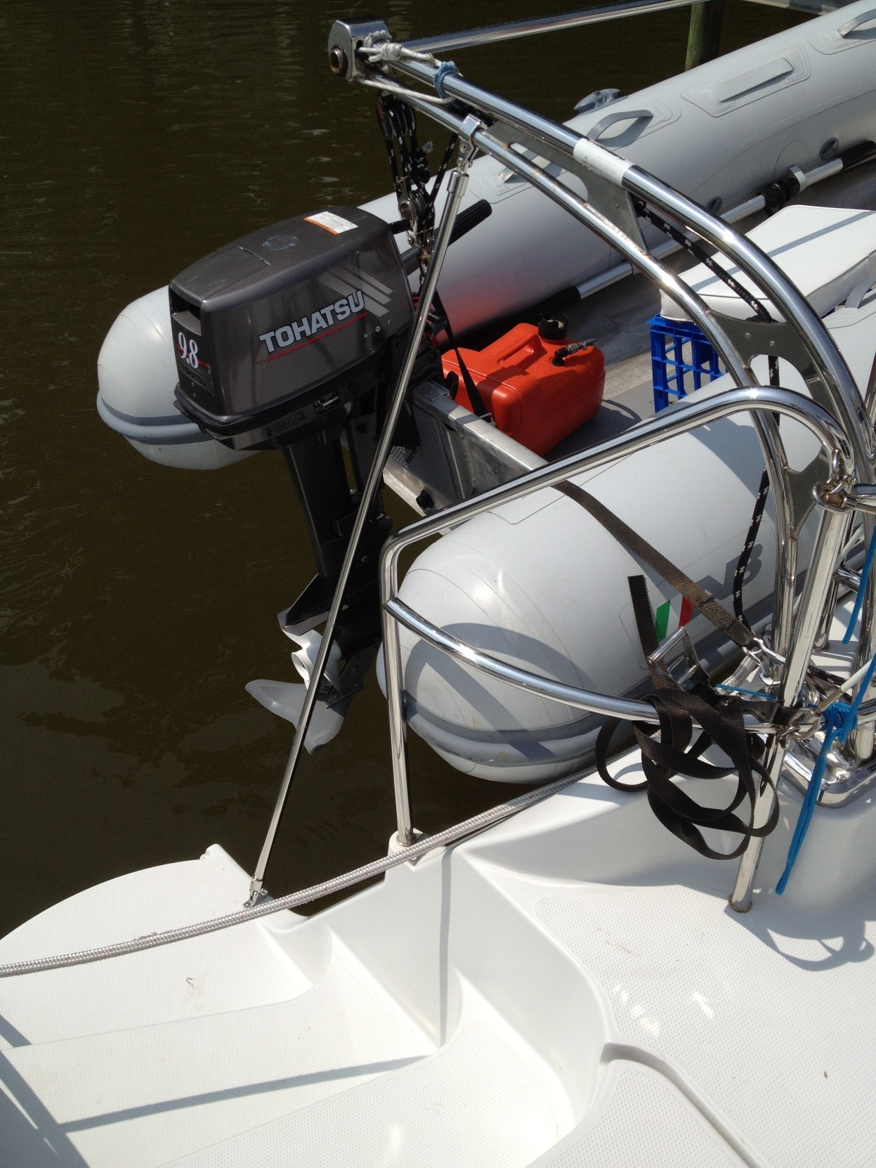 Added struts support a greater weight than the original Edson design. Note the blocks and lines for easier dinghy handling. Such davits are so easy to use and are one big advantage of a power catamaran.