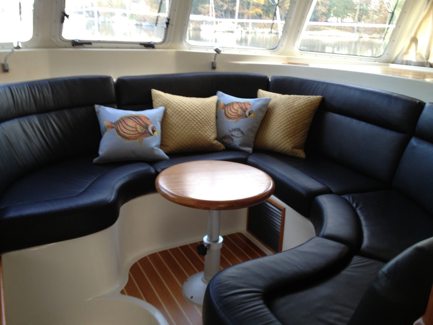 The smaller table in the saloon allows for more comfortable seating and does not require people to slide behind a large table.