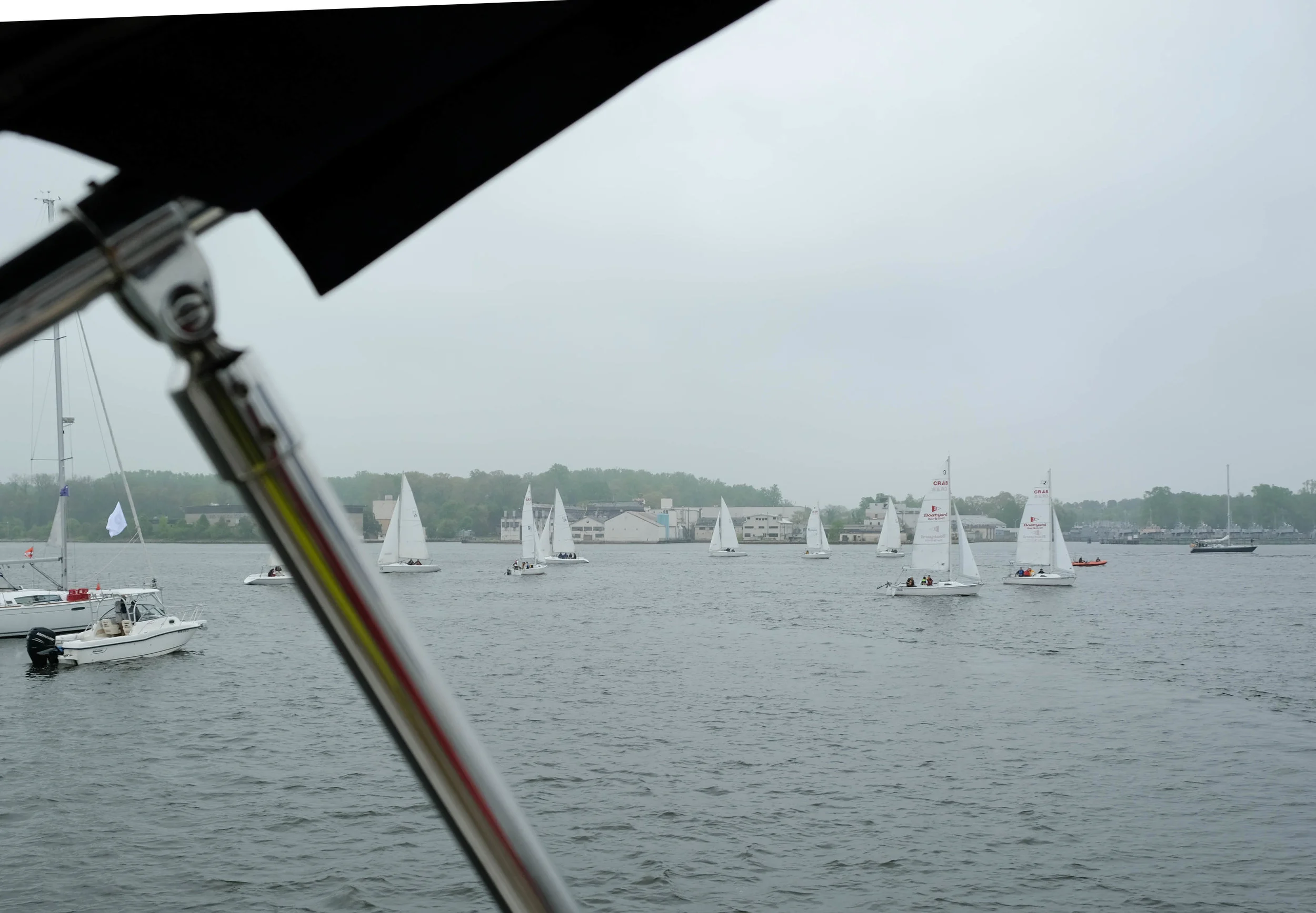 Not a bright sunny day, but the slight drizzle doesn't impact the fun everyone is having, and the midshipmen are honored to be sharing their knowledge of sailing with those who have been on active duty and given more than most in the service to their country.