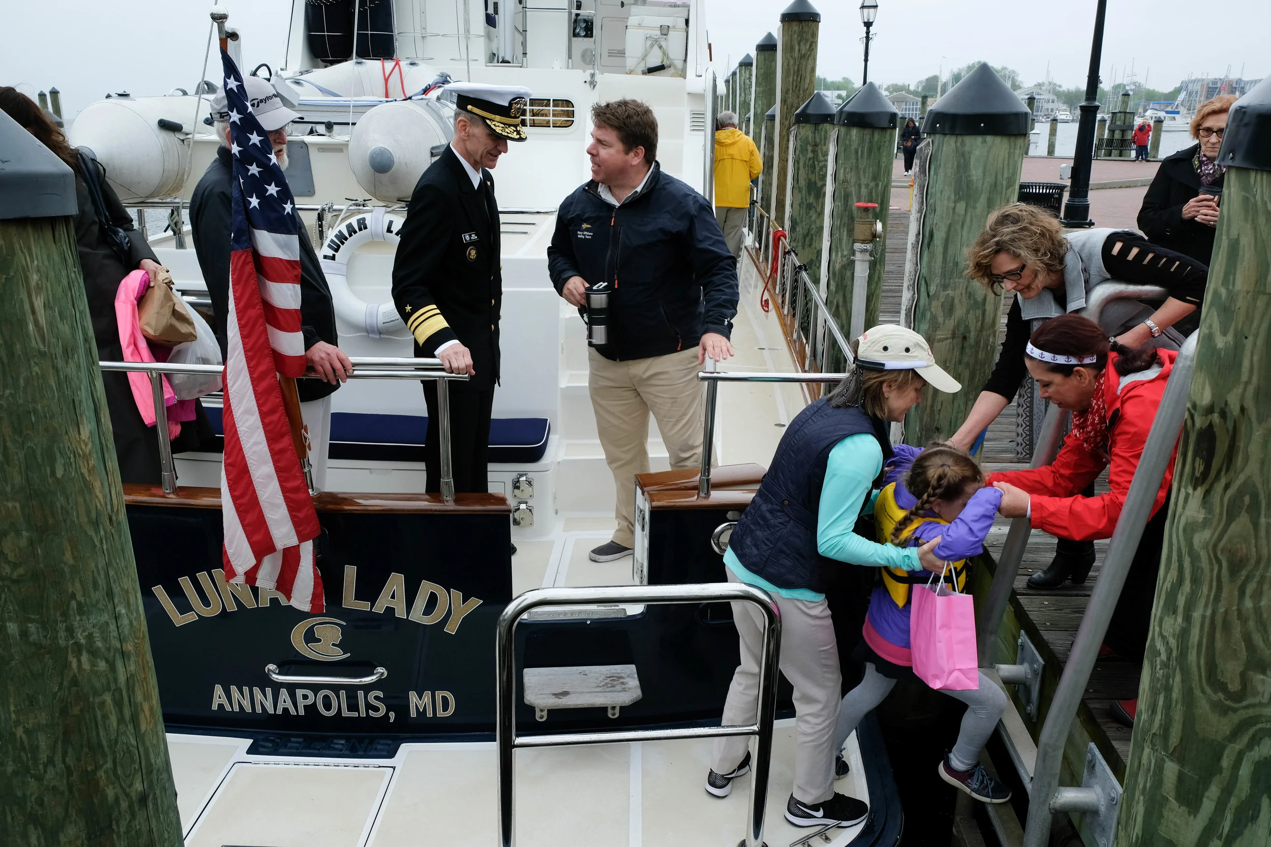 Back at the dock by the Sailing Hall of Fame, Les Spanheimer shares a few thoughts with Admiral Collom as the spectators depart Lunar Lady for a buffet lunch hosted by Mission BBQ. The day felt positive, and we all hoped for a healthy future for these recovering men and women. Hopefully they can learn to live with the scars from their service and get on with living healthy and productive lives. Unfortunately, the threat of suicide and other problems continue to plague our returning military.