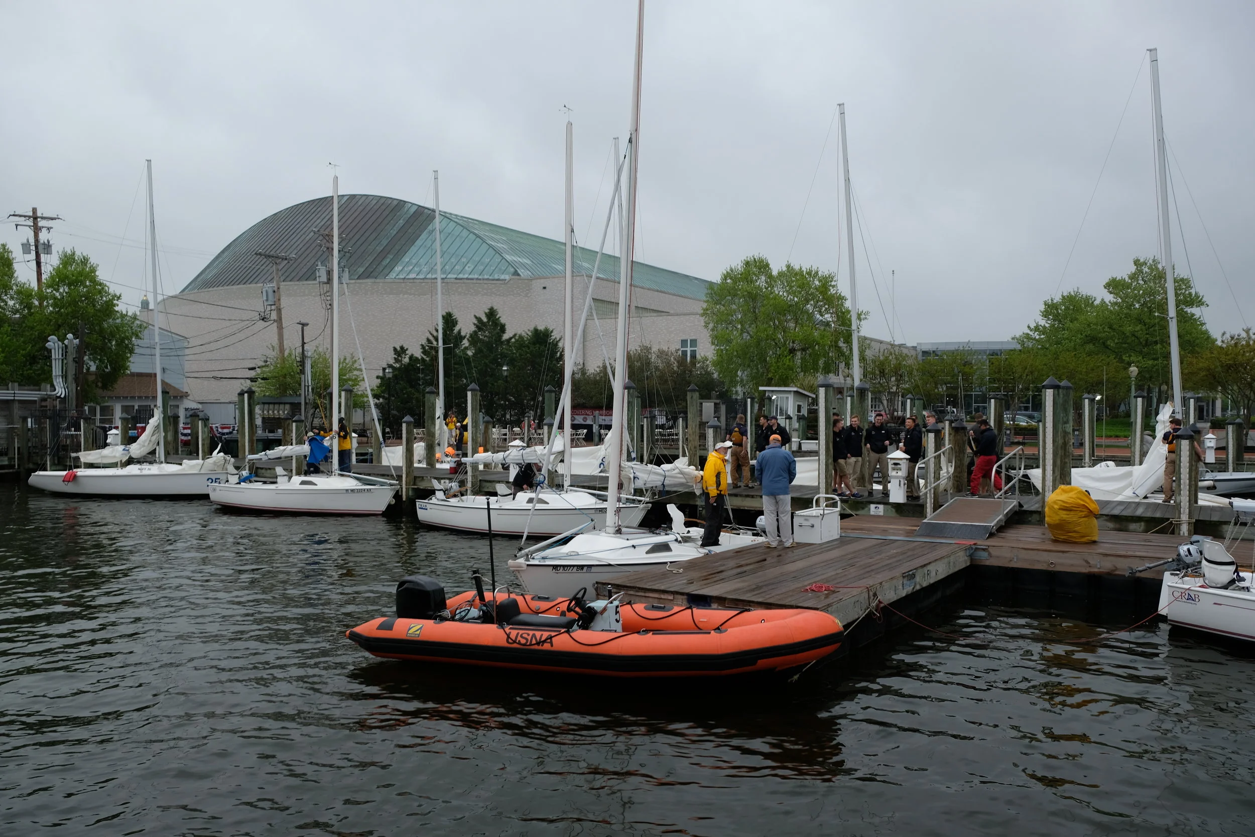 The fleet of one design boats wait for the bus from Walter Reed. The recovering warriors come with a variety of injuries. Should be a good day on the water, and the midshipmen are excited to be a part of this program..