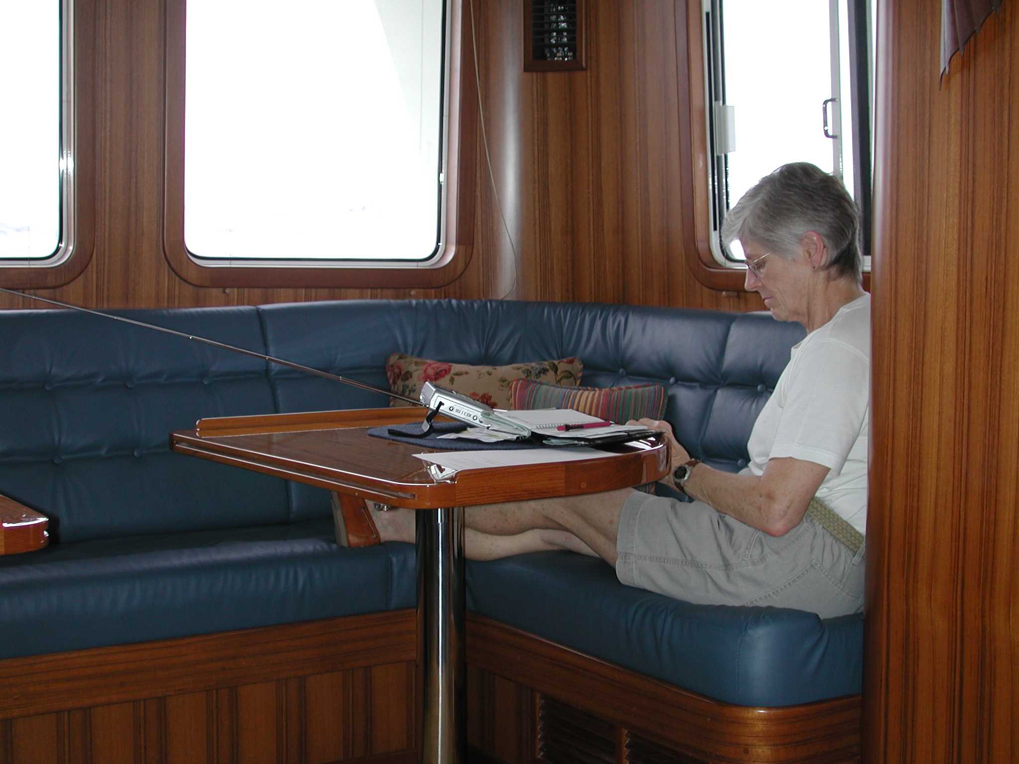 Enjoying quiet time in the pilothouse, away from those on watch, even though the saloon has a couple of wonderful Ekornes Stressless recliner chairs. Unless the saloon door to the cockpit is open, she'd rather be up here.