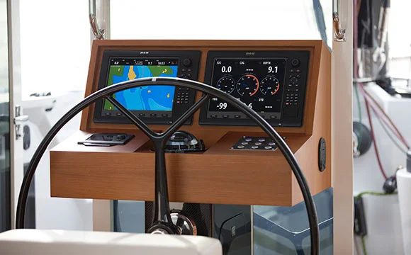 A modern helm for a Torqeedo-powered catamaran seems more Starship Enterprise than a traditional trawler helm. This yacht is a Gunboat.