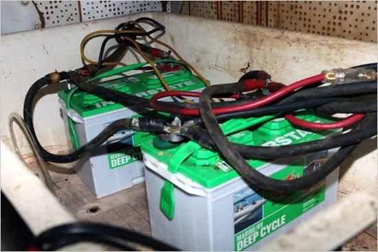 Not much to like in this picture. Too many cables, nothing keeps the batteries from sliding around, which guarantees the connections will work loose. Yikes!