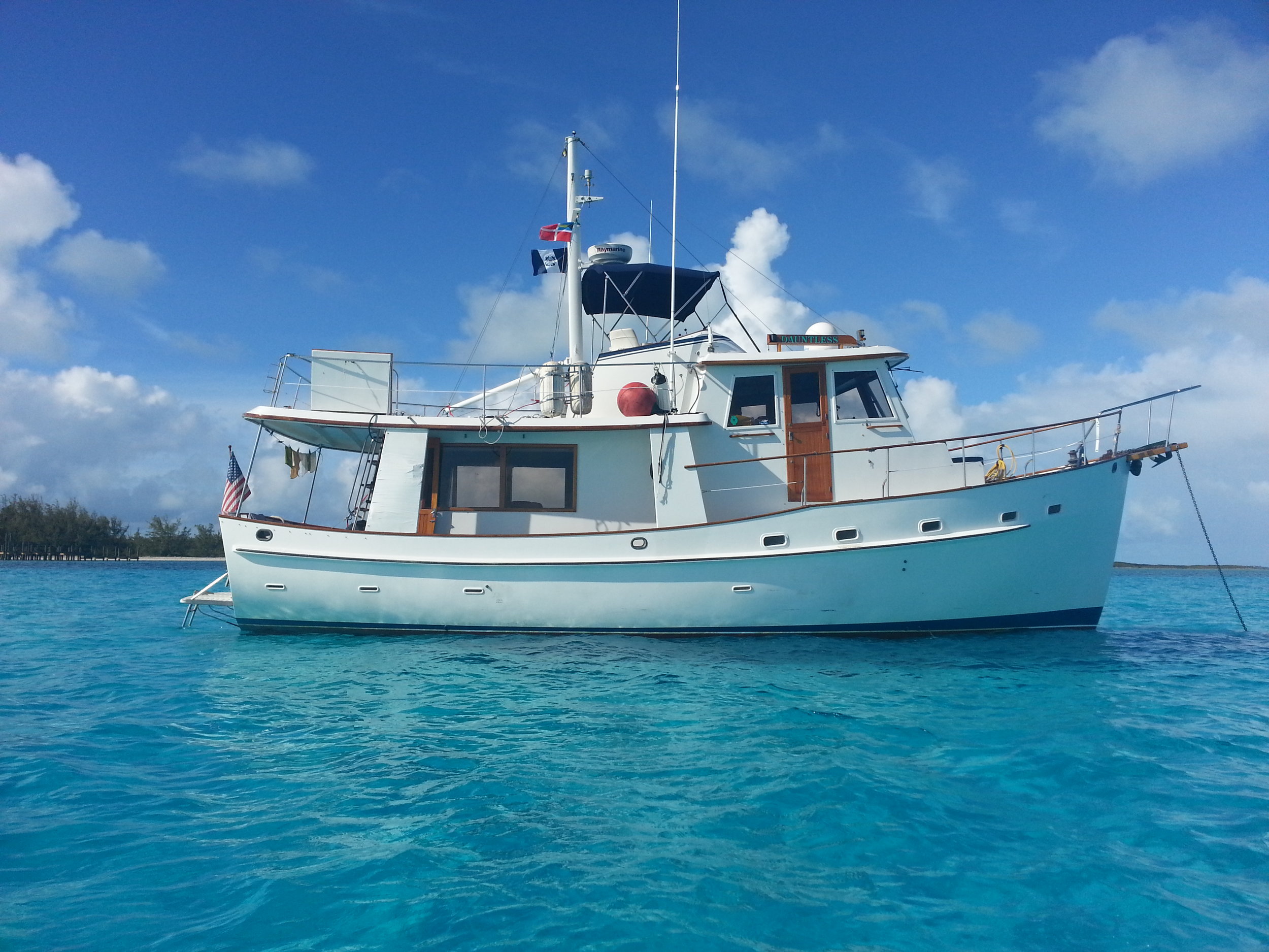 At anchor in paradise is the sweet spot of full displacement trawlers, able to carry the stores, batteries, and the independence of freedom.