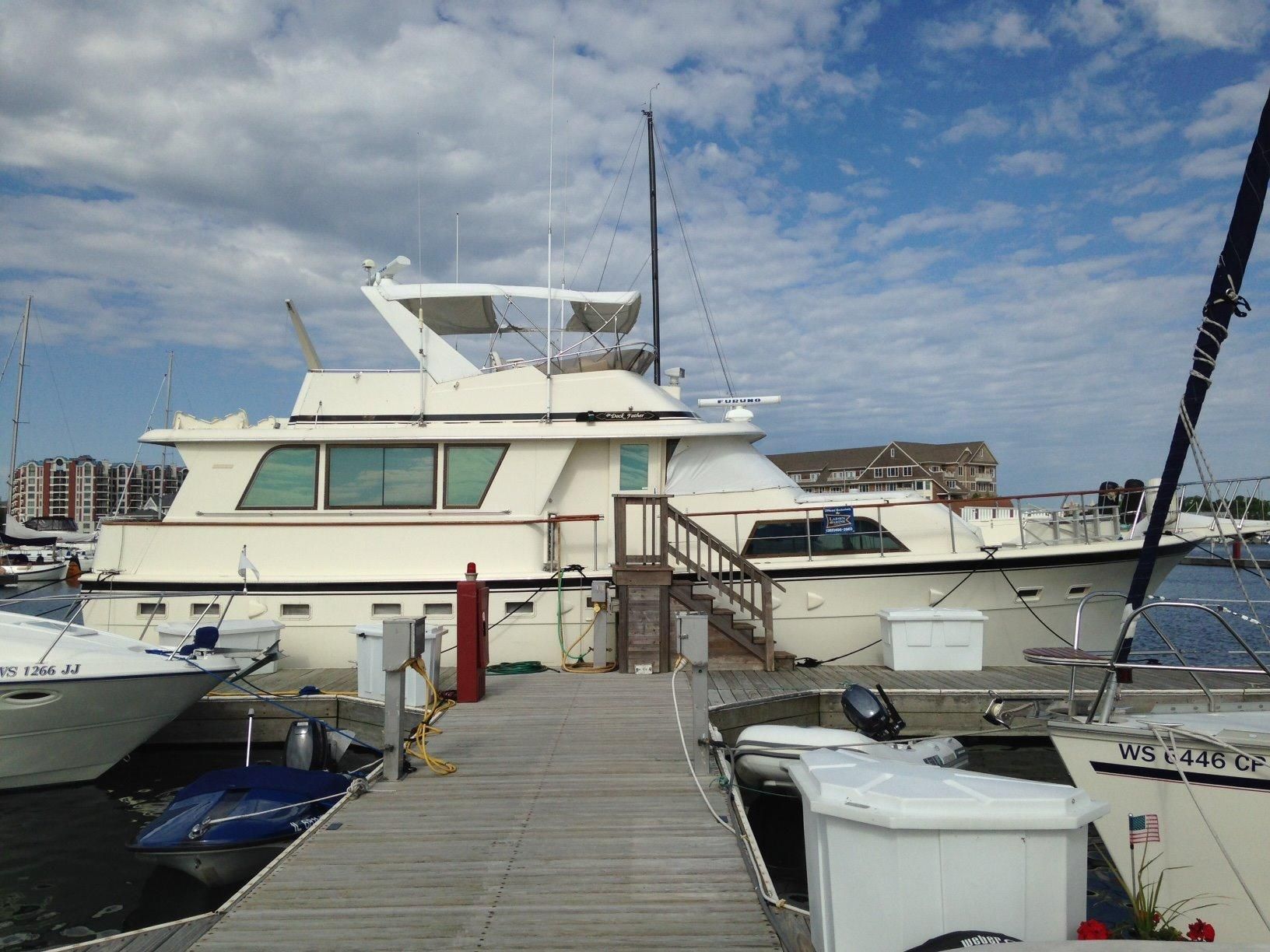 Larger than your typical cruising boat, this Hatteras needs outside assistance for crew to board easily. You get the idea of why this is not a good thing, right?