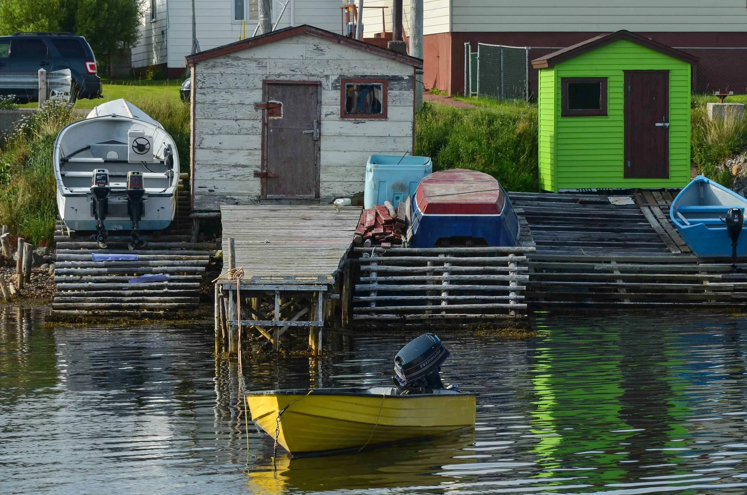 Local fishing boats in Francois. Slightly larger boats like the one in the upper left almost always have twin outboards. The engines are small because of fuel costs but twins allow a margin of safety. A stalled outboard in these waters could quickly turn into more than an inconvenience.