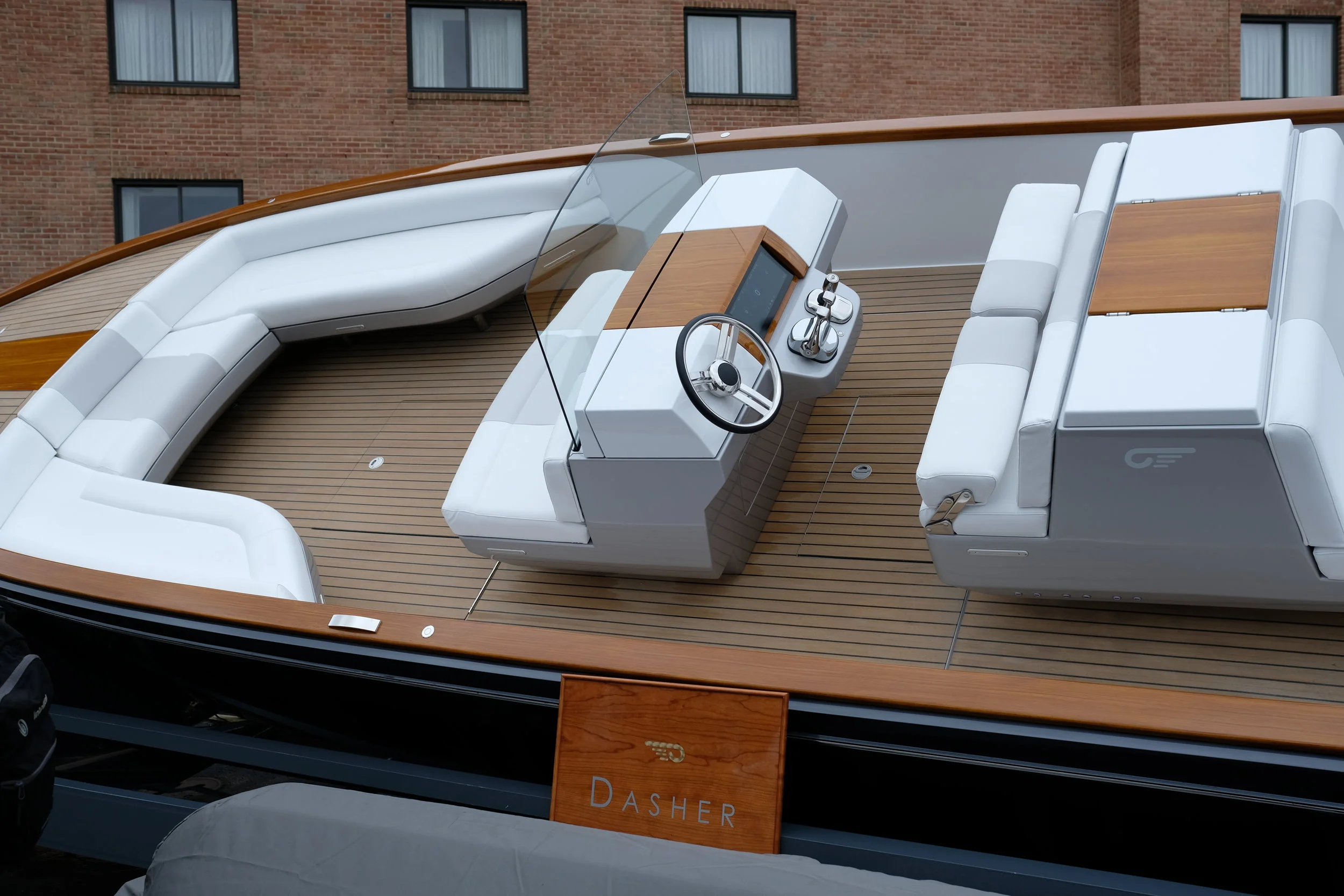 The Hinckley Dasher is an electric cocktail cruiser using two Torqeedo inboard motors. This is a high-tech powerboat. And there is no wood on this boat, despite what you see. The ultimate illusion.