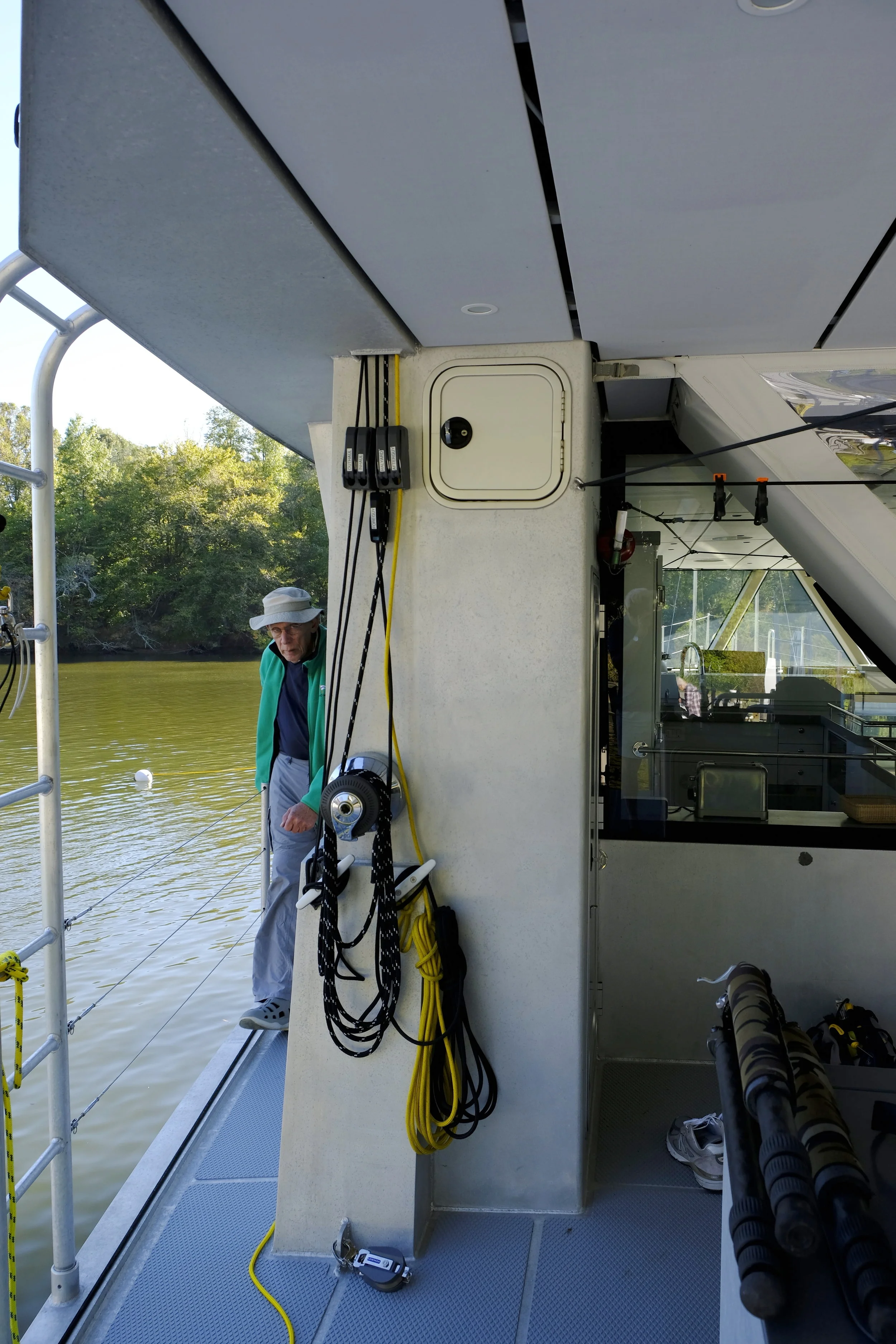 Winches and jam cleats on both sides of the boat control the boom and adjust the cars on the track that move the strut ands boom sideways, as well as lifting the RIB and rowing boats.