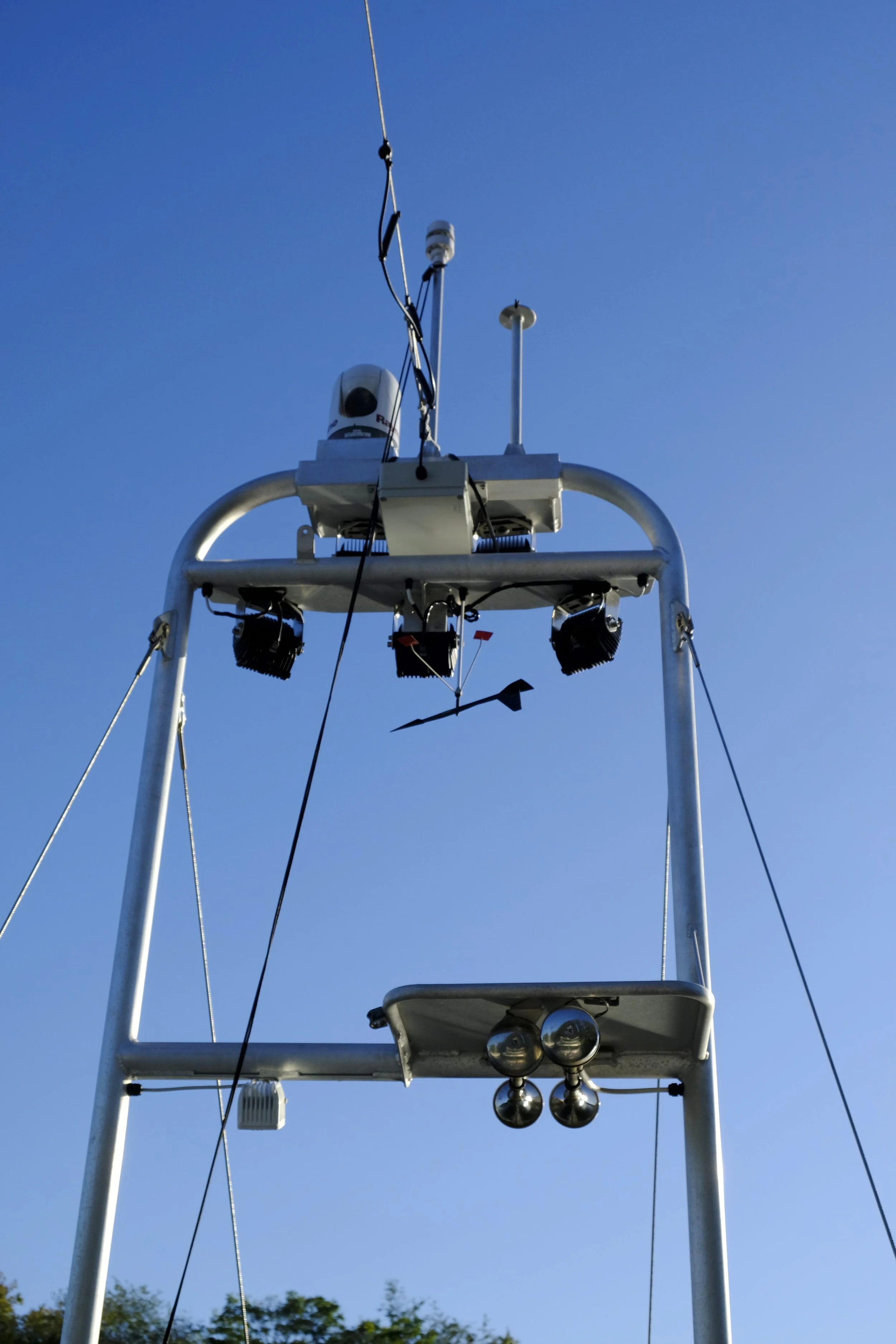 The structure on the bow includes super bright LED lights, each with an eight-degree beam for lighting up what is in front of the boat. Each is adjustable. As seen here, they are pointing down in front of the boat to illuminate lobster pots, as  Cochise  recently come down from up north. Normally they would be aimed far in front of the boat.