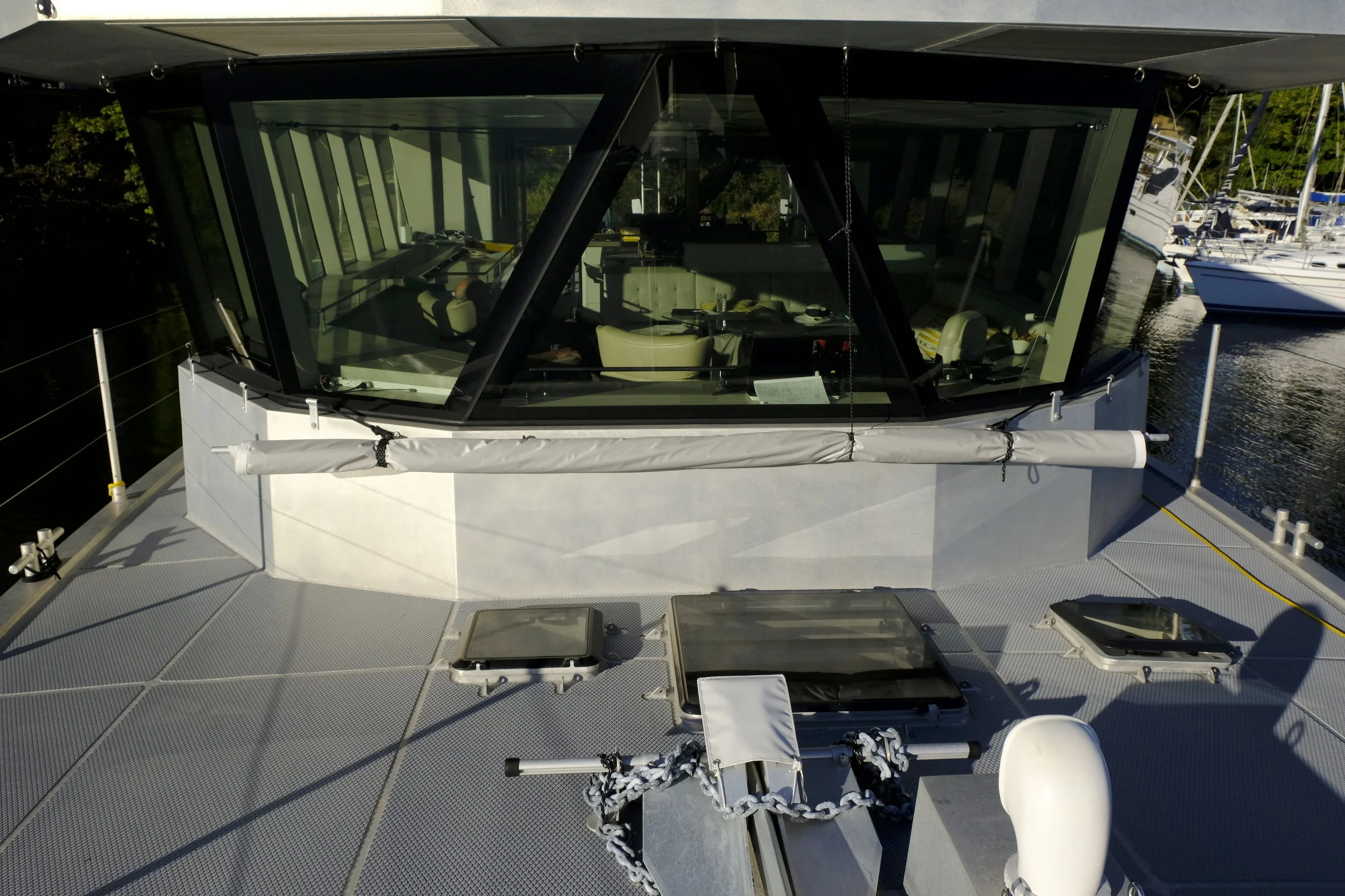 This awning covers the forward accommodations and is very effective at anchor with the hatches open in the tropics. I don't know why more boats take advantage of such simple ways to keep temperatures down in paradise.
