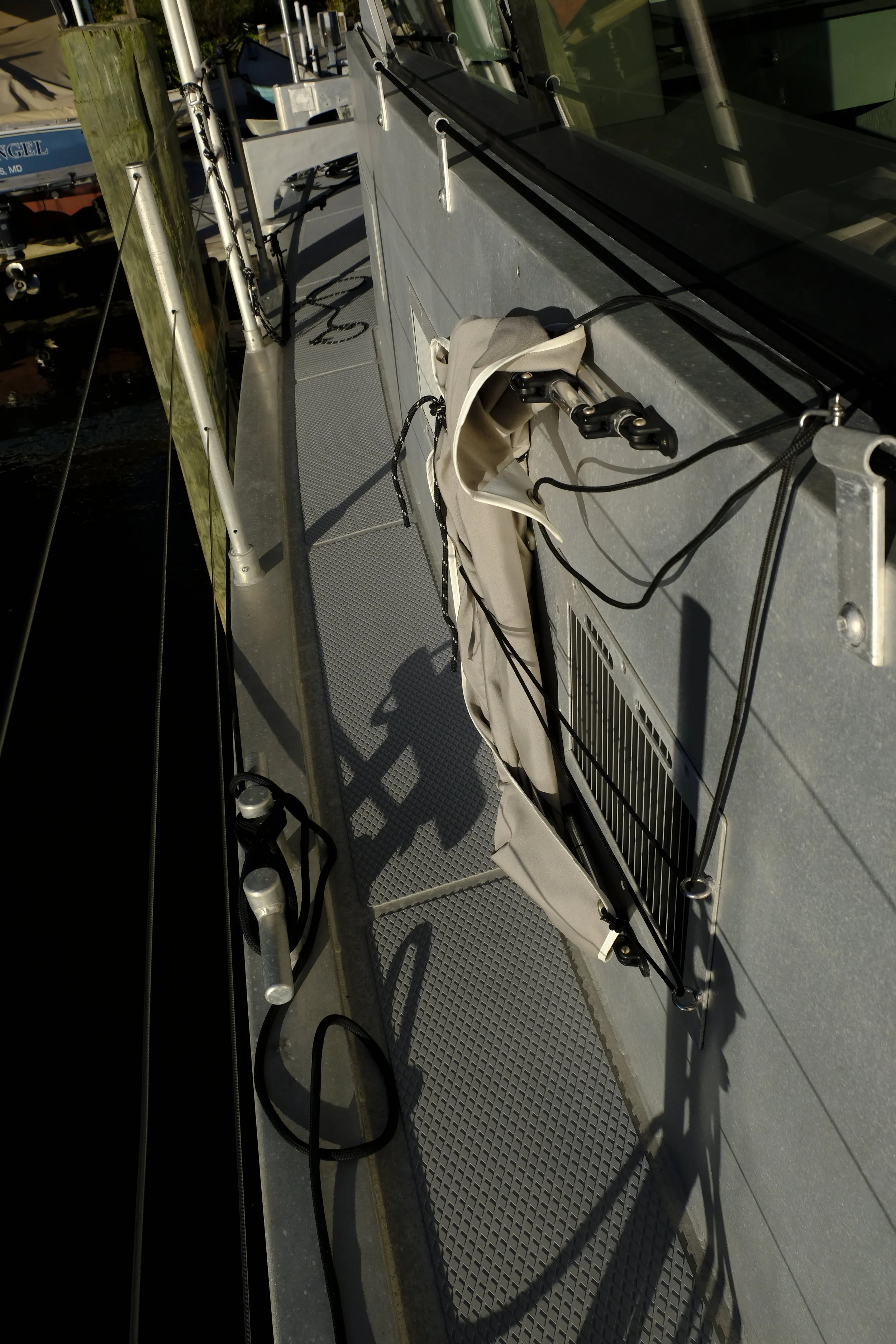 A side Dorade vent pull lots of air into the interior, and the spray hoods keep out the elements. This vent brings air into the starboard side of the saloon, next to the steps between the saloon and the accommodations. See below.