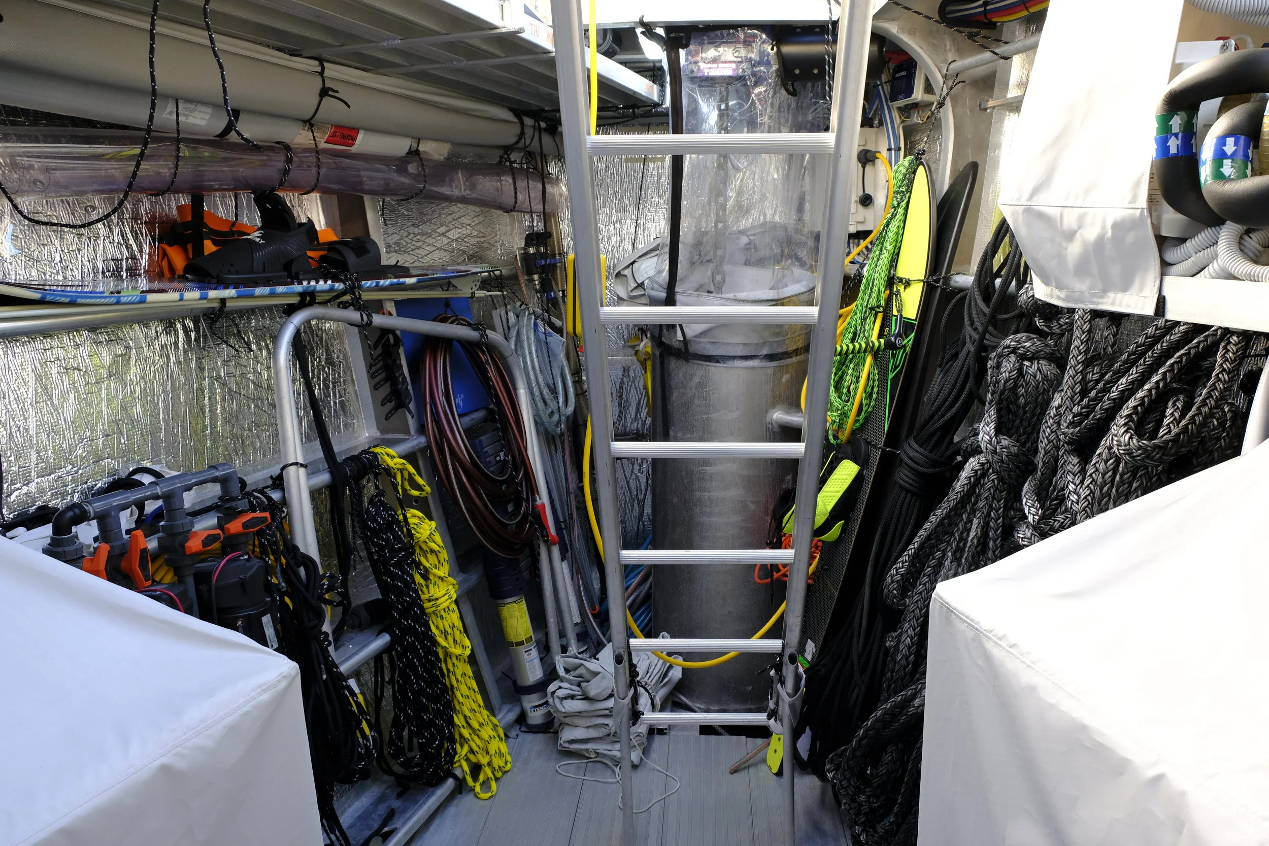 The chain barrel in the bow eliminates the tendency of anchor chain to ball up, and the mud screen keeps the forepeak clean. They do not wash down the chain when they raise the 150kg Manson anchor. It can be rinsed in the barrel, however, and mud drains overboard.