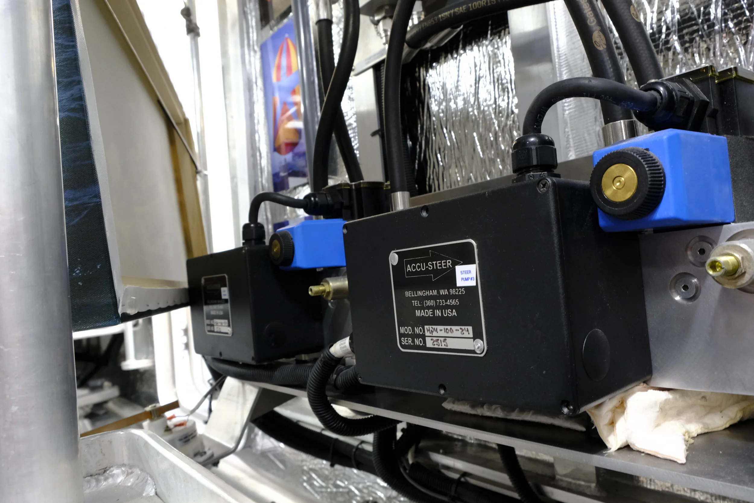 Now here is some cool stuff you don't see everyday. This is the second separate steering system on the port side of the boat. It consists of two identical Accu-Steer units, of which only one is normally online when he uses this redundant system.  The steering system on  Cochise  allows the rudders to turn through 45 degrees, which takes about 13 seconds from lock to lock. If Steve elects to bring the second pump online, in parallel to the first pump of this system, he can turn the rudders from lock to lock in about 7 seconds. This allows incredible maneuverability, as witnessed in Ft Lauderdale where he spun the big FPB in a narrow fairway, with only a few meters on either side of the boat as it turned around with mega yachts lining both sides. Given he does not use a bow thruster, this system gives him amazing turning ability, especially with two, enormous 32-inch props that take advantage of the torque from the John Deere engines.