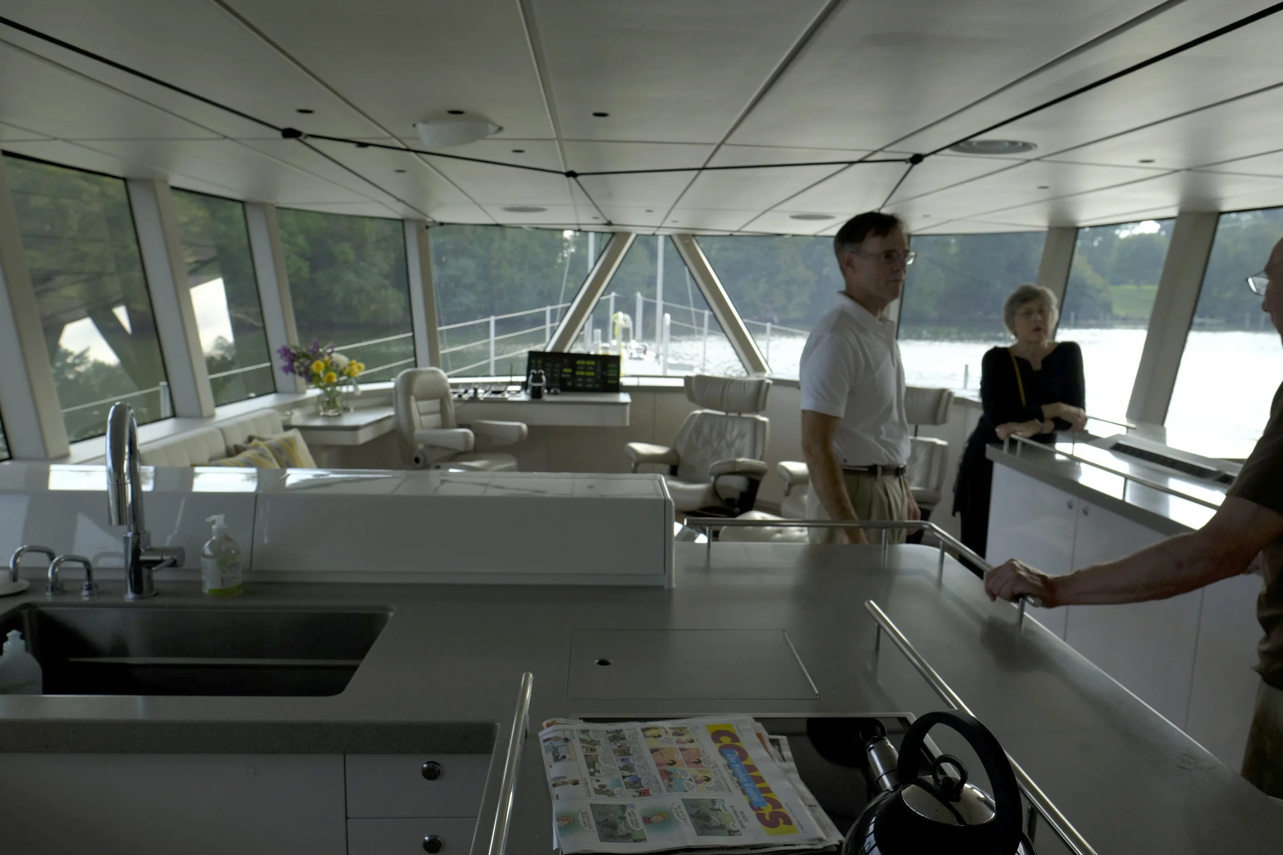 The lovely, sophisticated interior of  Cochise  makes for great living aboard. Note the large windows for outstanding visibility, the overhead Spectra lines that form a spider web of handholds, and the minimalist appointments. A very nice interior fro a cruising couple.