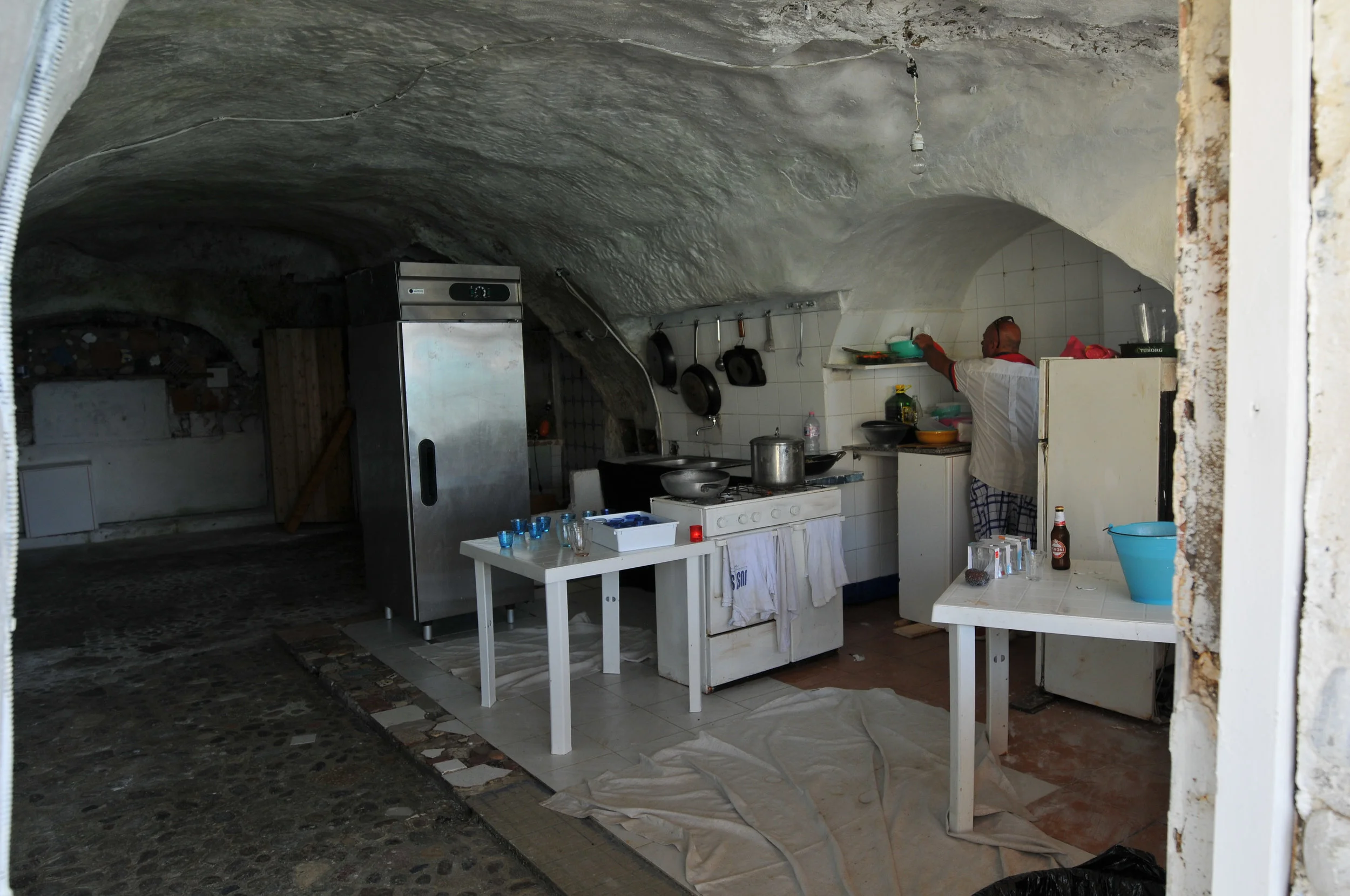 Cave kitchen that works. Note the tile. No slack here. It was a one-item menu with crusty bread, cold beer and red wine. What more could you want?