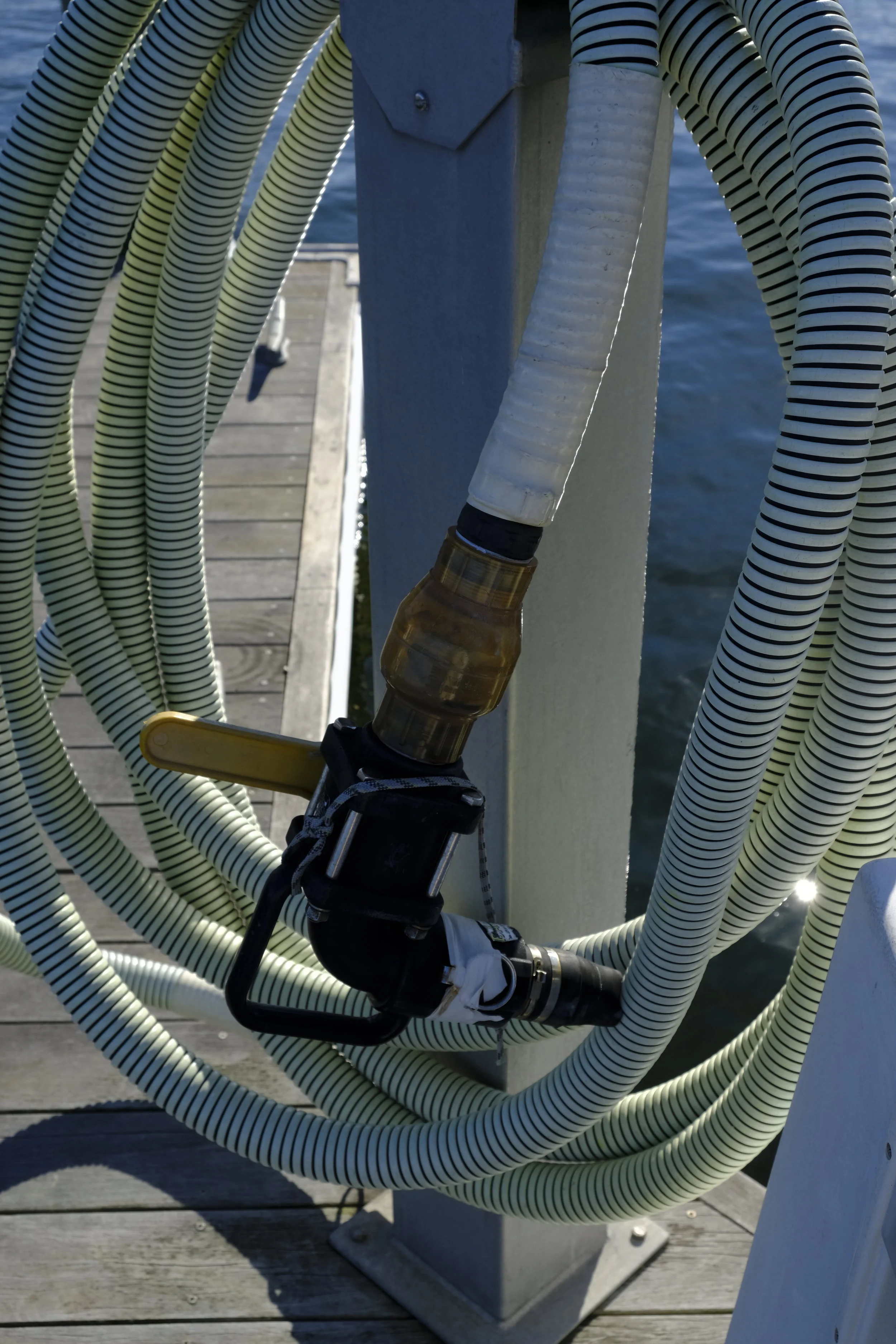 This is a common pumpout fitting, complete with beefy handle to allow the operator to keep the necessary seal of the hose tip on the discharge outlet. Break the seal, and the pump doesn't work.