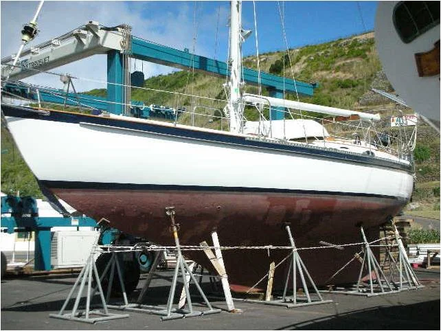 Pam Wall's KANDARIK hauled out for 9 months in the Azores. Note the Spanish Windlass of lines around the jack stands in case of earthquakes.