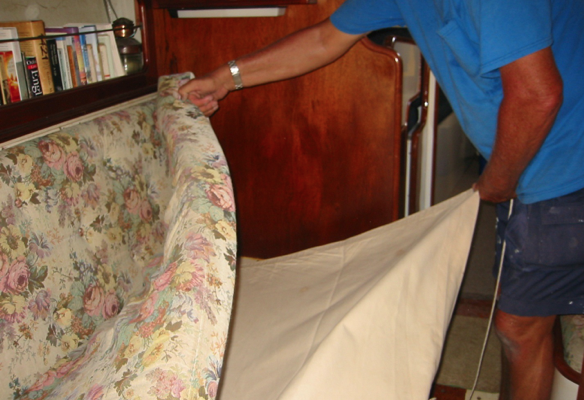 When not needed the lee cloth tucks under the settee cushions.