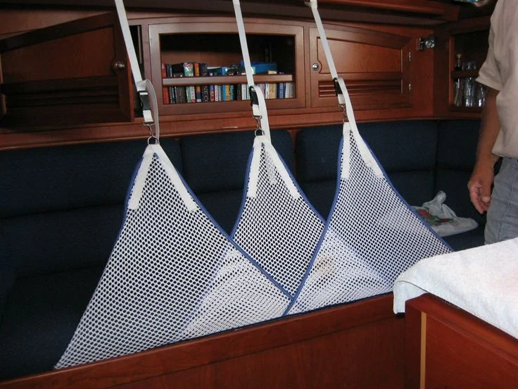 There are many ways to rig satisfactory lee cloths. One only really needs to be long enough to keep the middle of one's body secure. No need for claustrophobic coverage that blocks air flow. It is really quite comfortable for a tired crew member to sleep soundly.