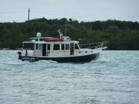 This was taken by a woman aboard a Krogen 42 I just passed. The couple recognized Growler and waved to us .