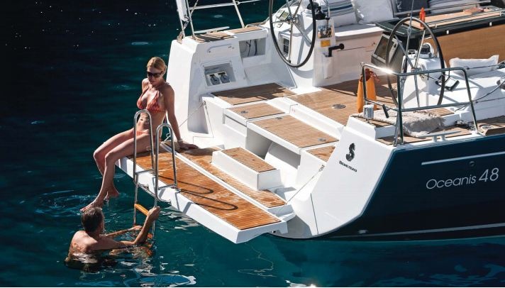 A good compromise between convenience and security found on this Beneteau Oceanis 48. Notice the hinged swim platform that can be pulled up flush to the transom, leaving no steps available from a small boat.