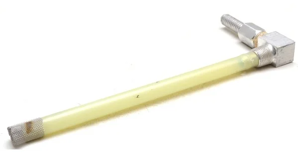 This fuel pickup tube is wrong for several reasons. The lower end should not have a screen, and the tube's end should be cut at an angle, with the lowest part of the tube end just off the bottom of the tank, perhaps 3/4-inch off the bottom. But if it can't be removed to inspect, you'll never know if it was done correctly, or cut too short, leaving gallons of fuel out of reach.