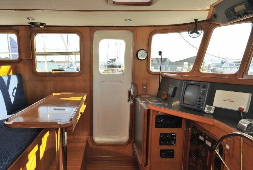 Electronics spread across a wide console means you can't drive the boat from a helm chair and effectively use the Furuno radar or plotter at the same time. Note the genset panel located under the console.