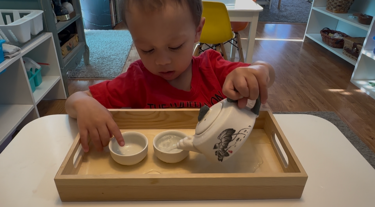 toddler pouring water - Edited.png