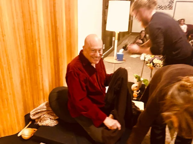 Shin’s Mins (Minions) untangle and free him after his final nightly Dharma talk, commending us all on Work well done.