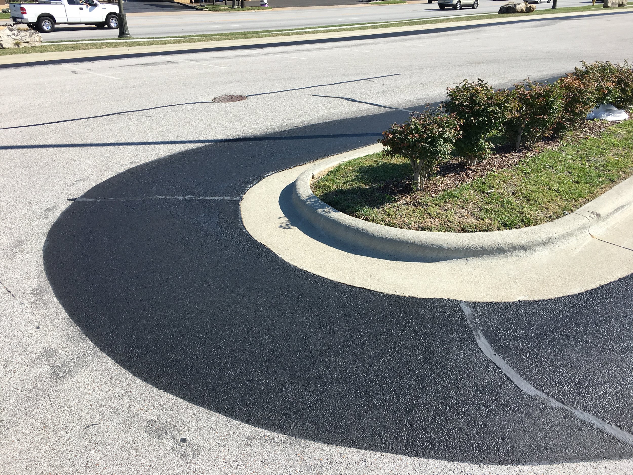 Springfield Striping and Sealing coating a high traffic location with better protection to improve the roads durability