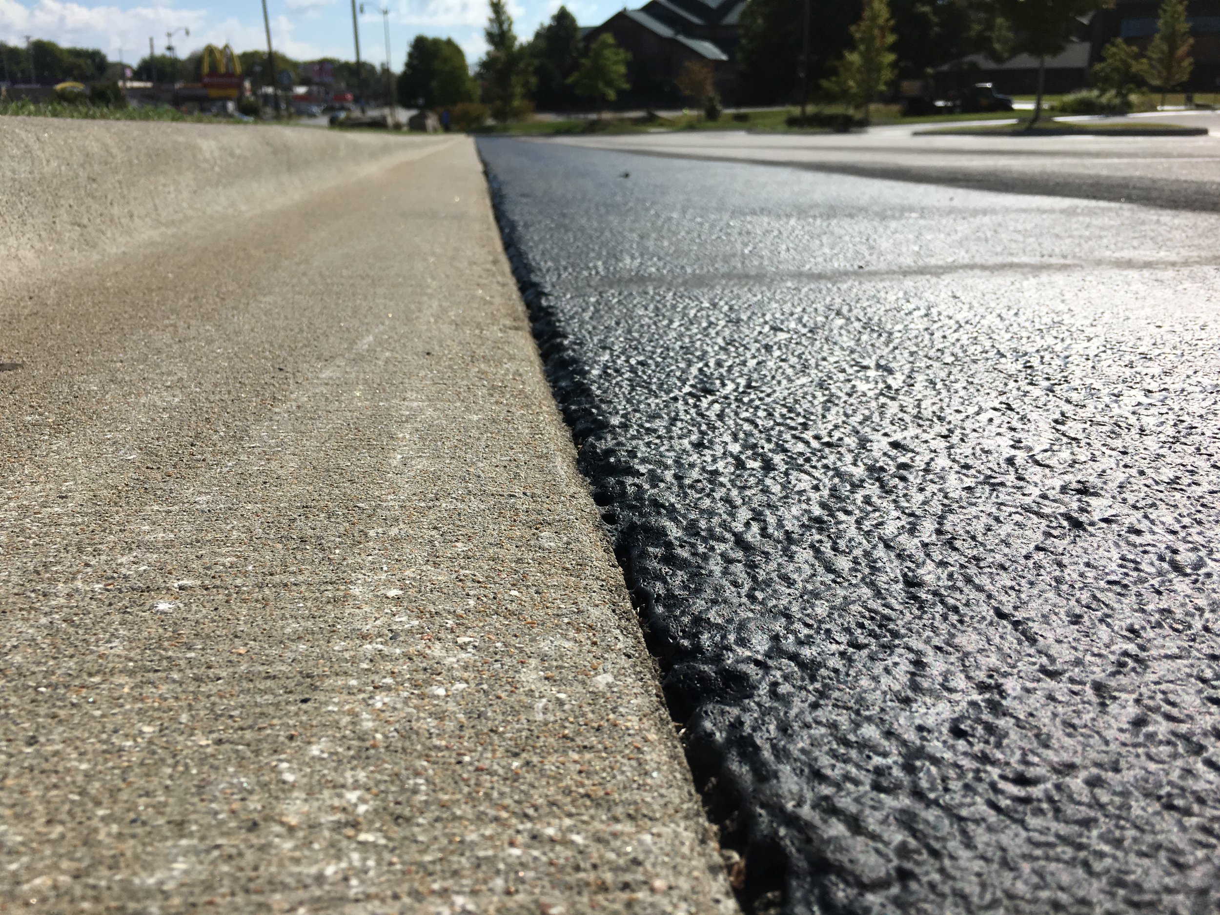 Close up view of fresh pavement at Wonders of Wildlife parking lot, services by Springfield Striping and Sealing in Springfield, Missouri.