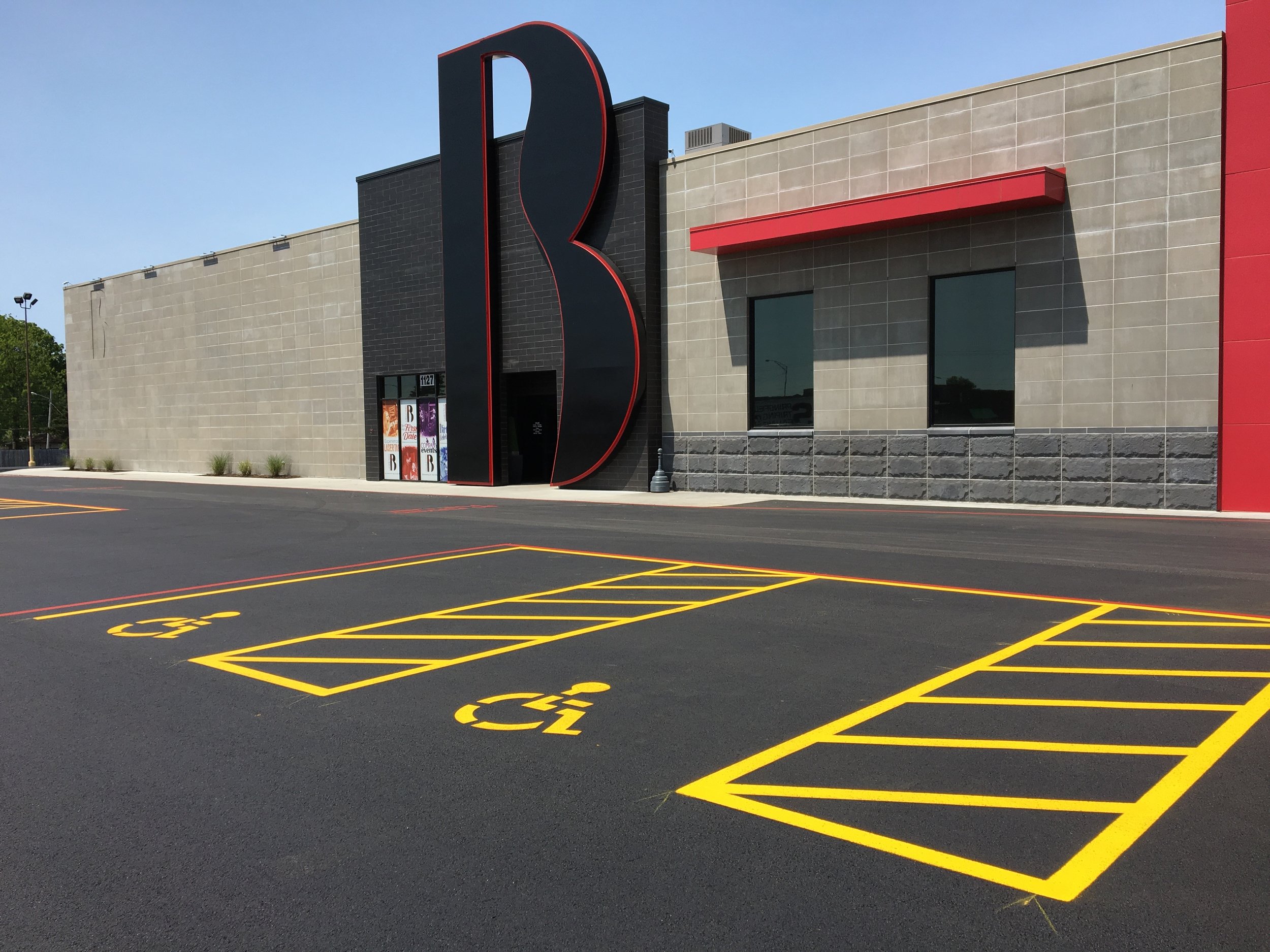 Vibrant striping detail of handicap parking on a freshly sealed parking lot, completed by Springfield Striping and Sealing in Springfield, Missouri.