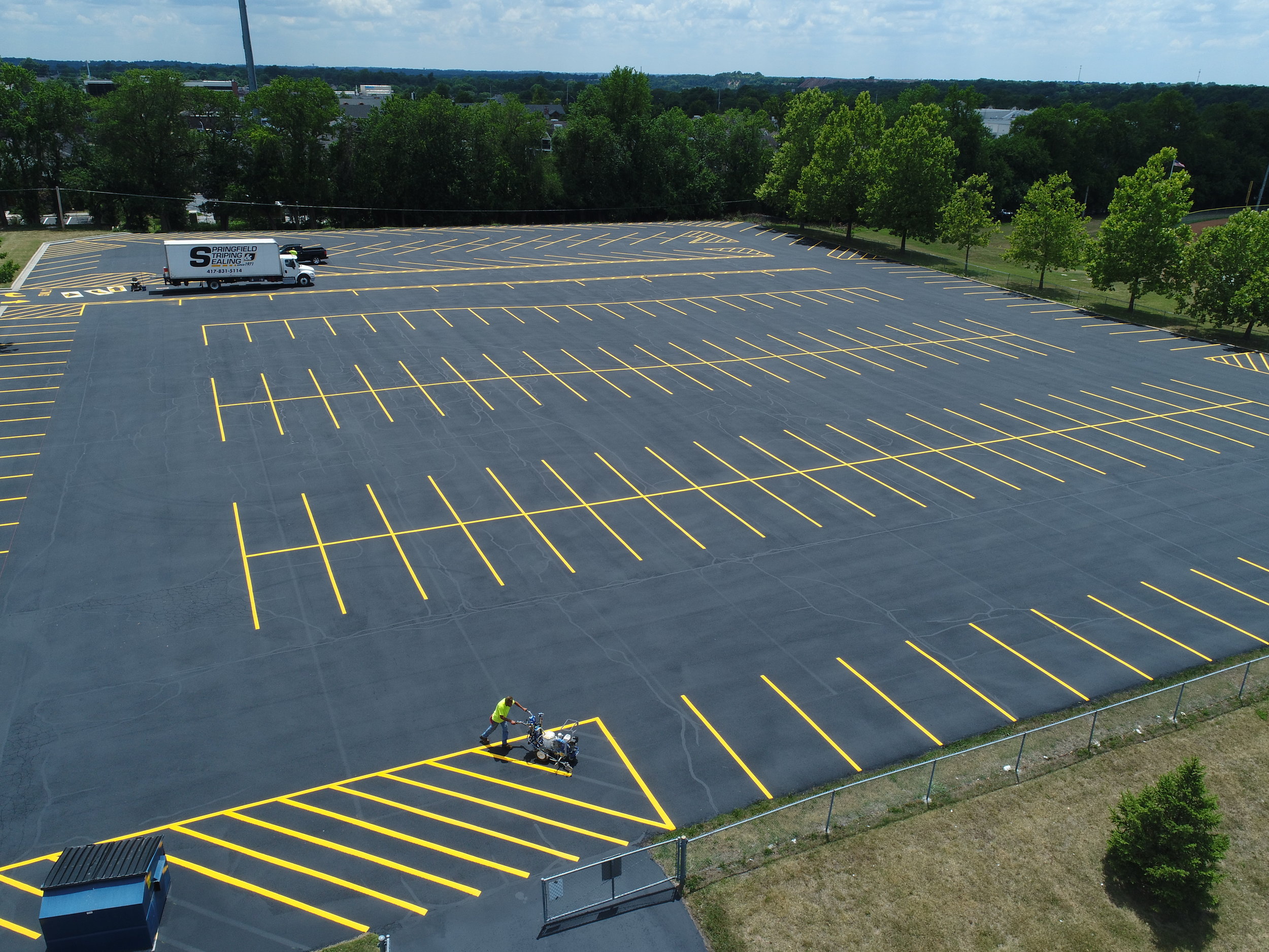 Detailed view of a parking lot during the striping phase, featuring geometric precision and high-quality workmanship by Springfield Striping and Sealing in Springfield, Missouri.