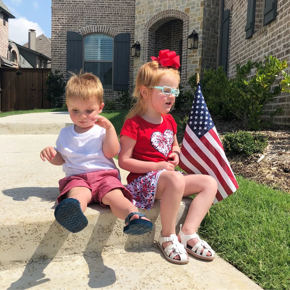Skylee and Duke celebrating the 4th of July on our sidewalk