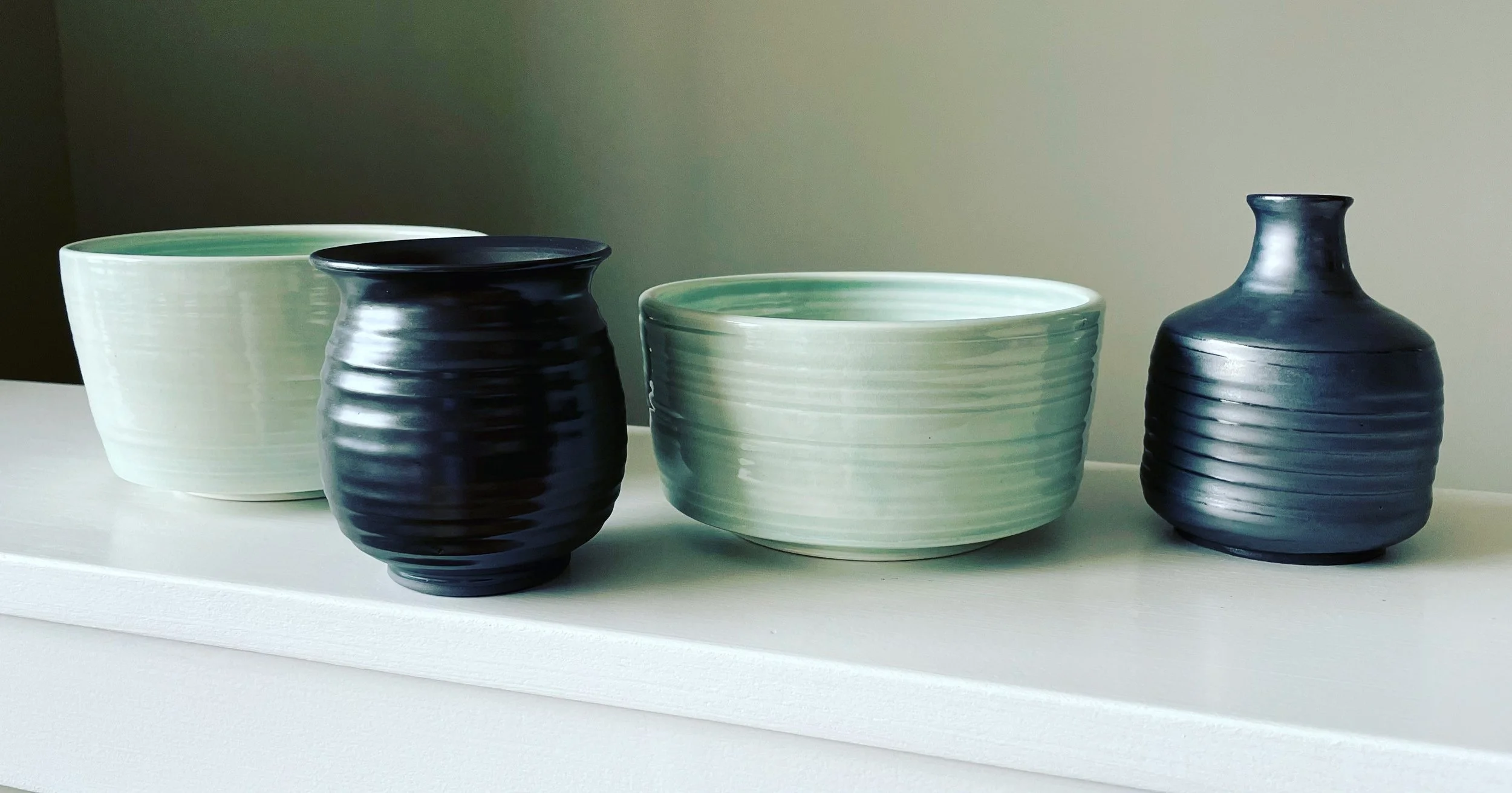 celadon bowls and metallic vases