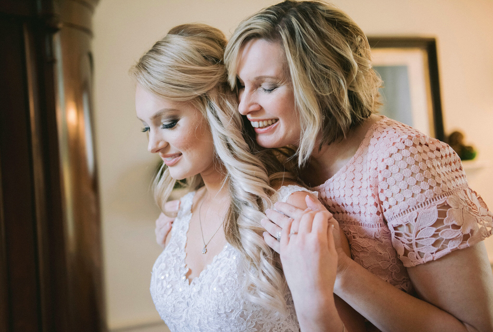 Candid wedding moment with mother and daughter