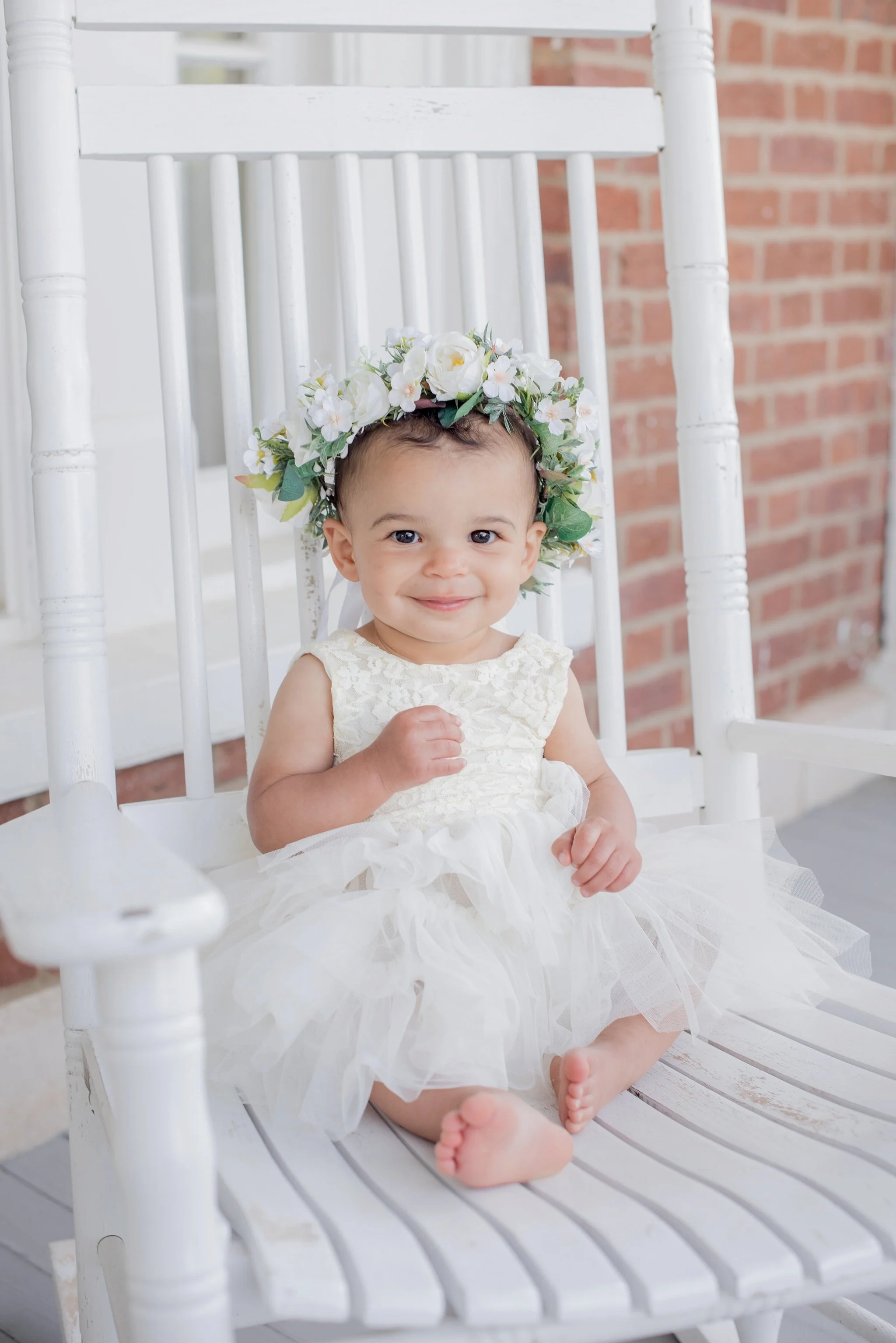 Baby photos on a porch