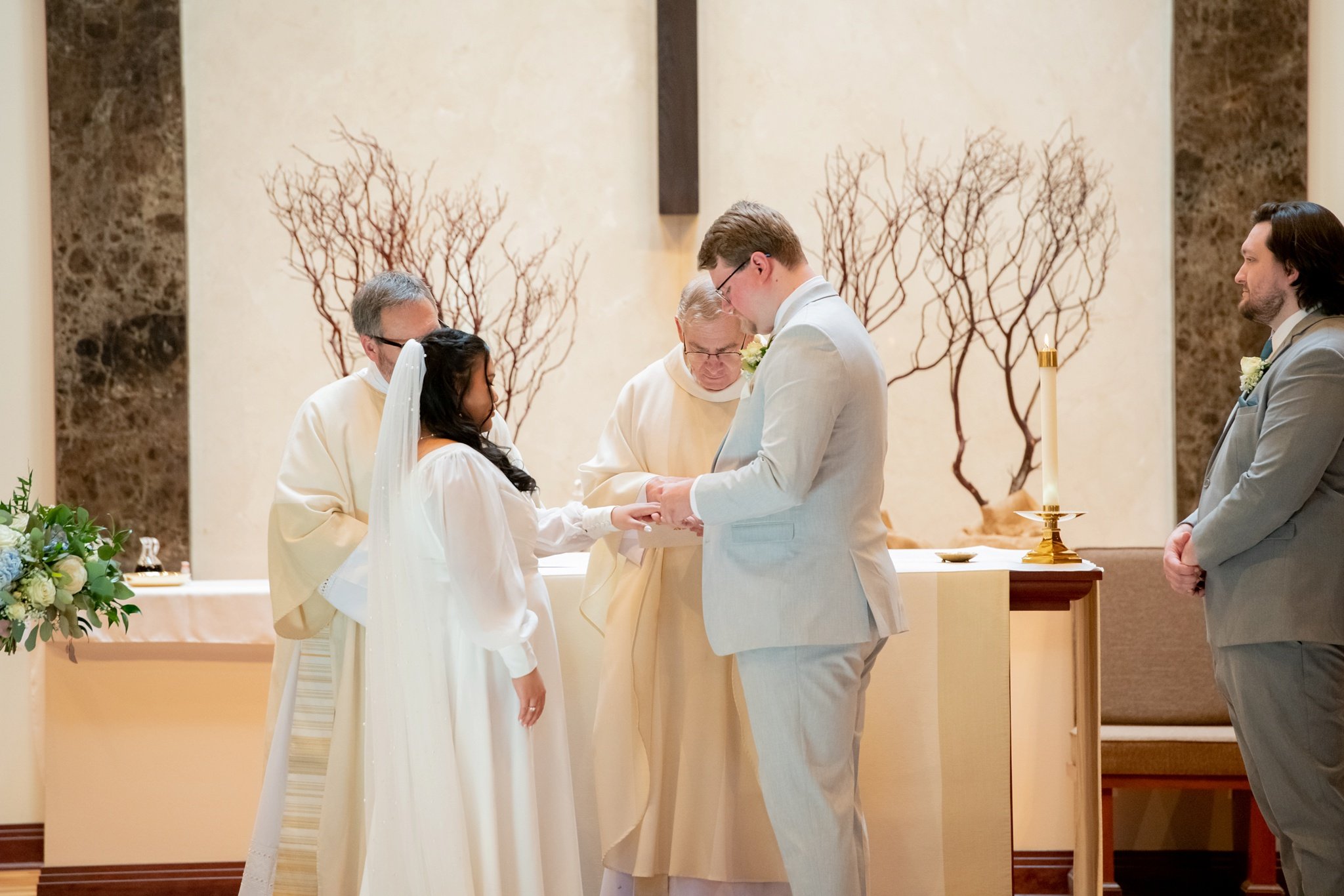 bride and groom exchanging rings