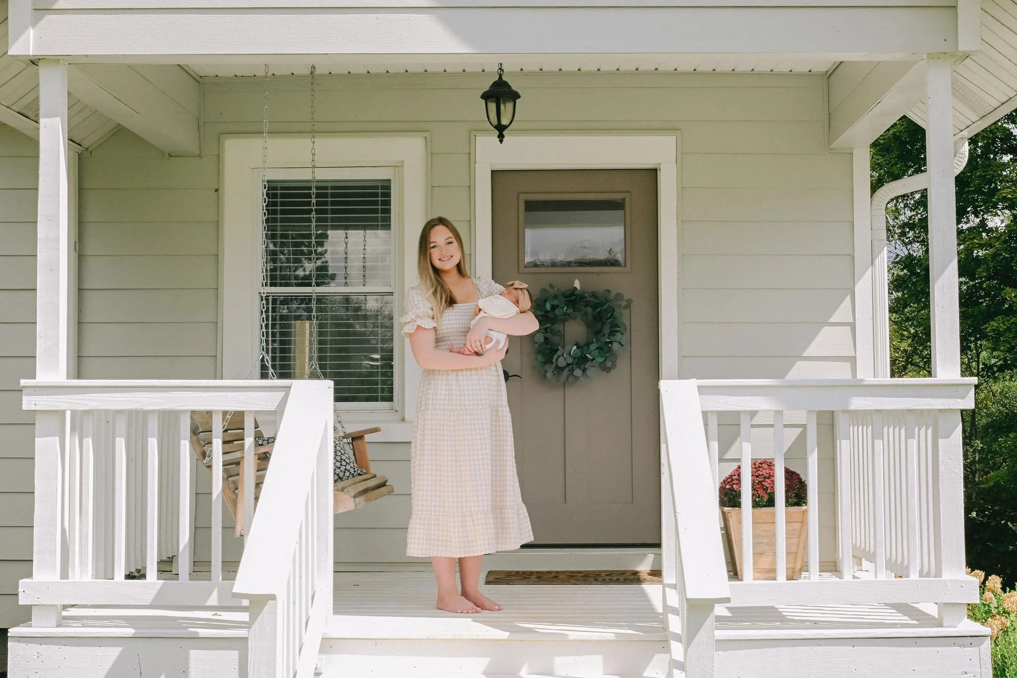 newborn photography on porch of home